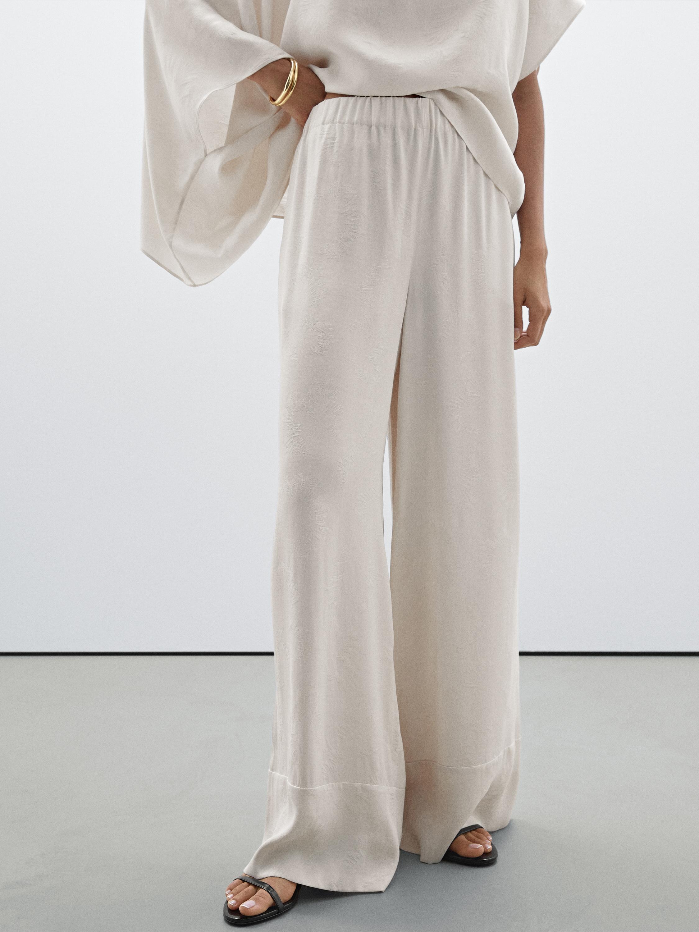 Printed fabric trousers with hem detail