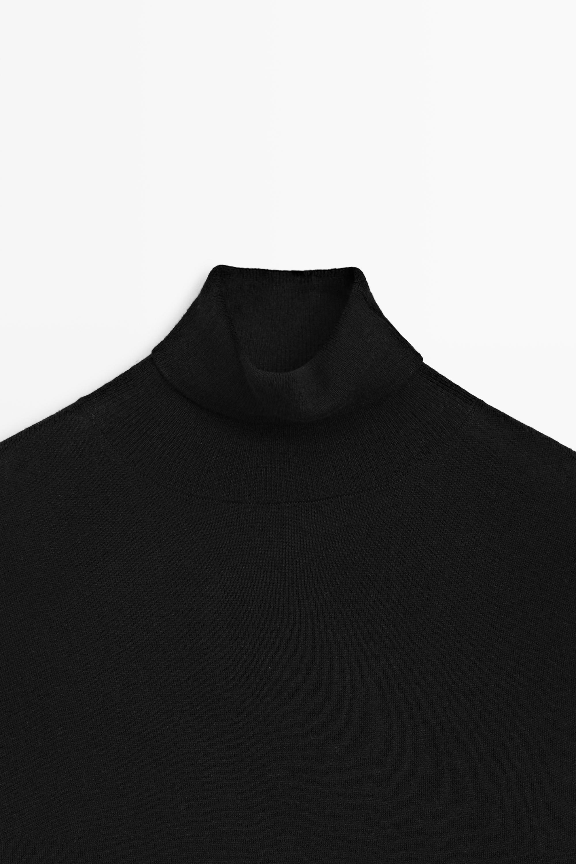 Asymmetric hem turtleneck top — BLACK