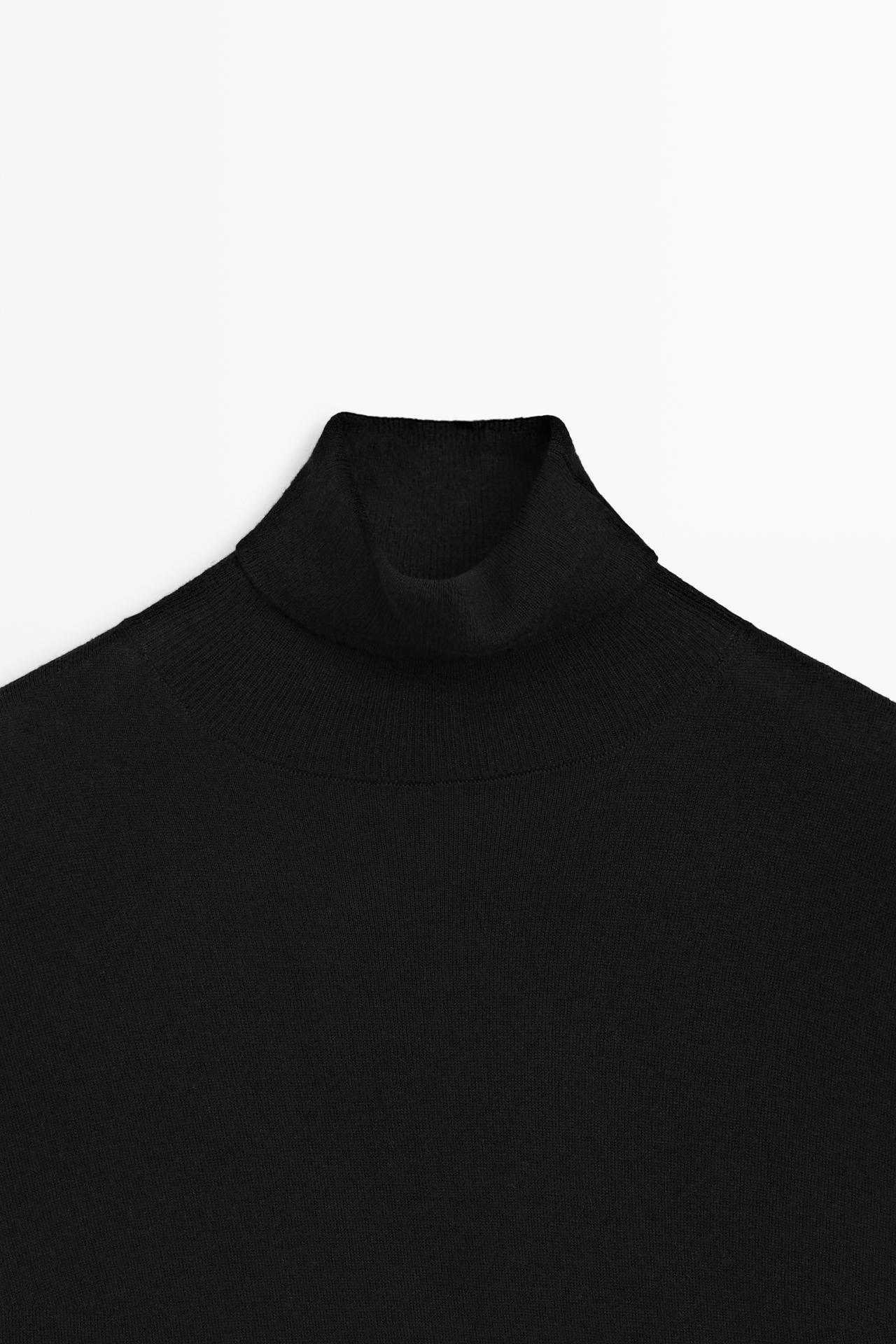 Asymmetric hem turtleneck top — BLACK