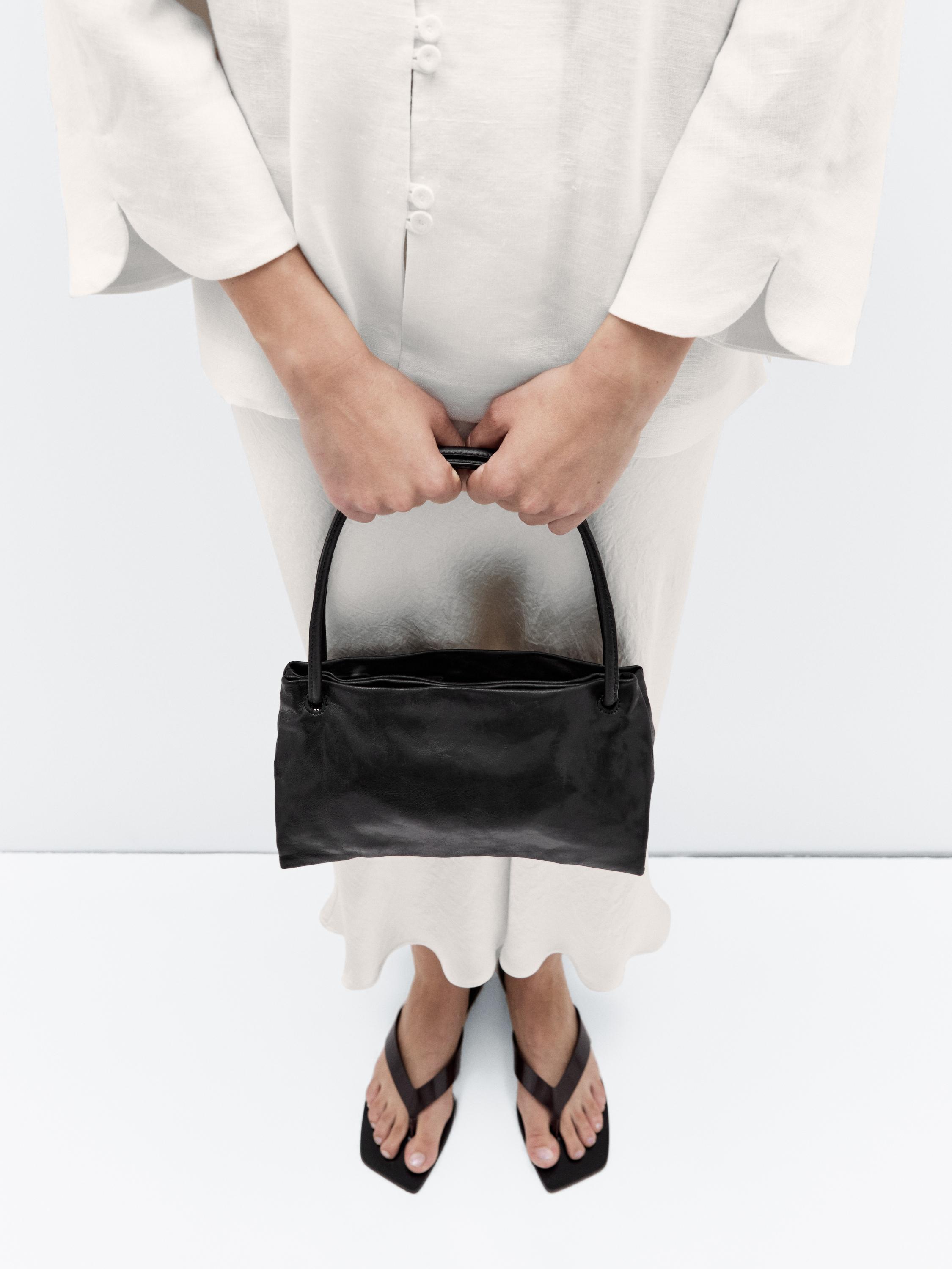 Small nappa leather bag with compartments