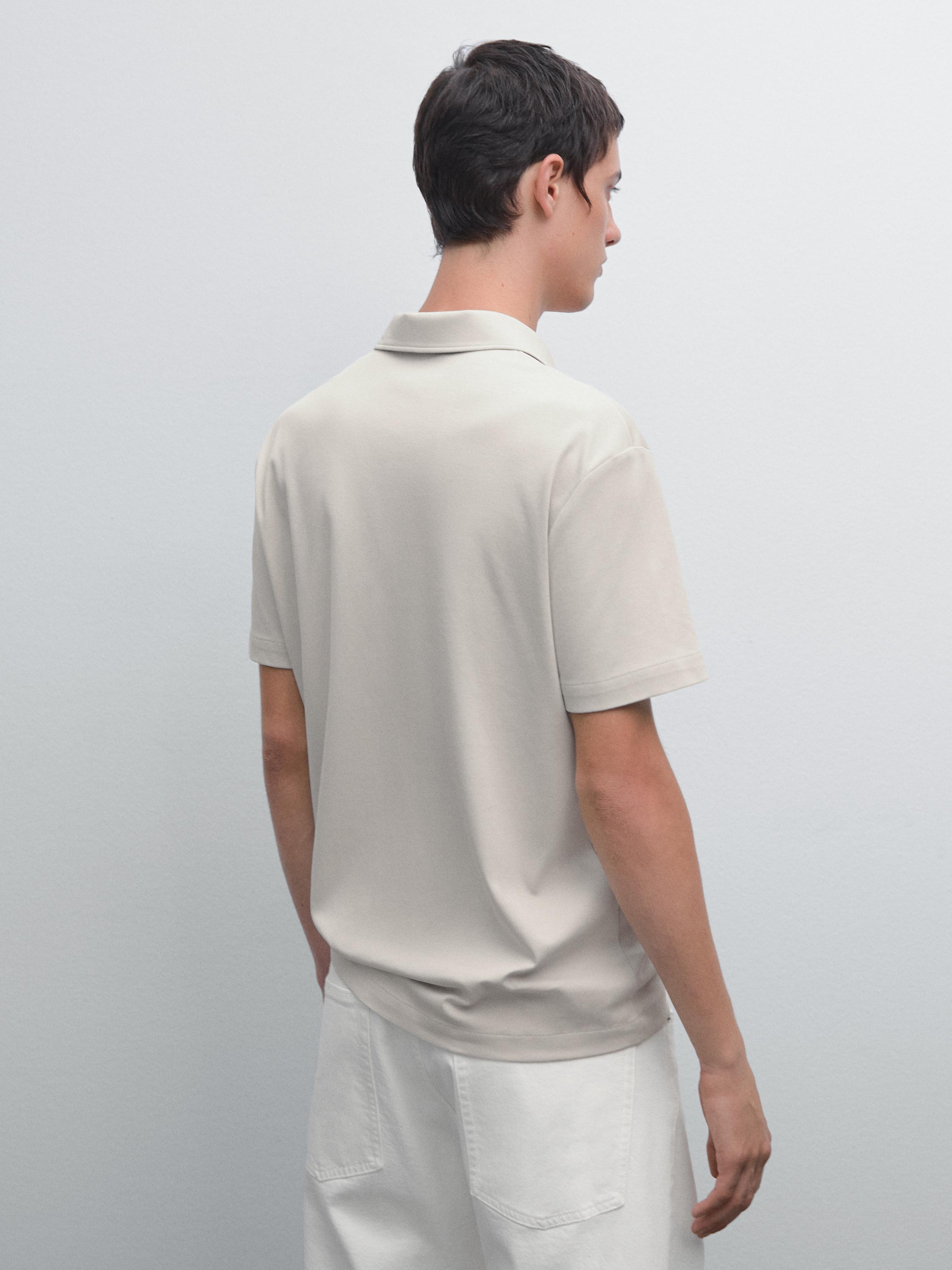 Short sleeve polo shirt with snap-button placket