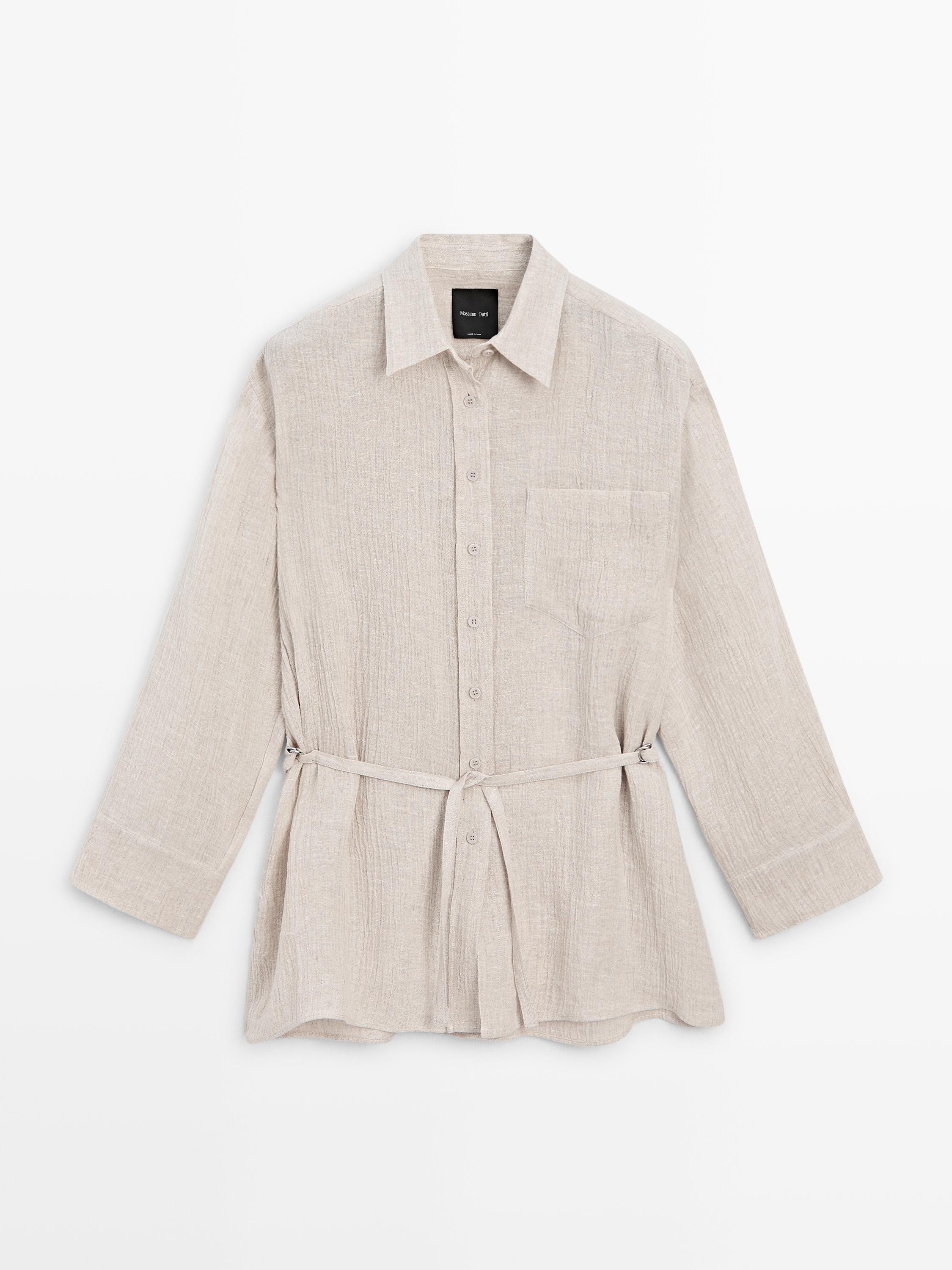 Front view of a sand overshirt with a classic collar, central button placket, chest pocket, and adjustable belt.