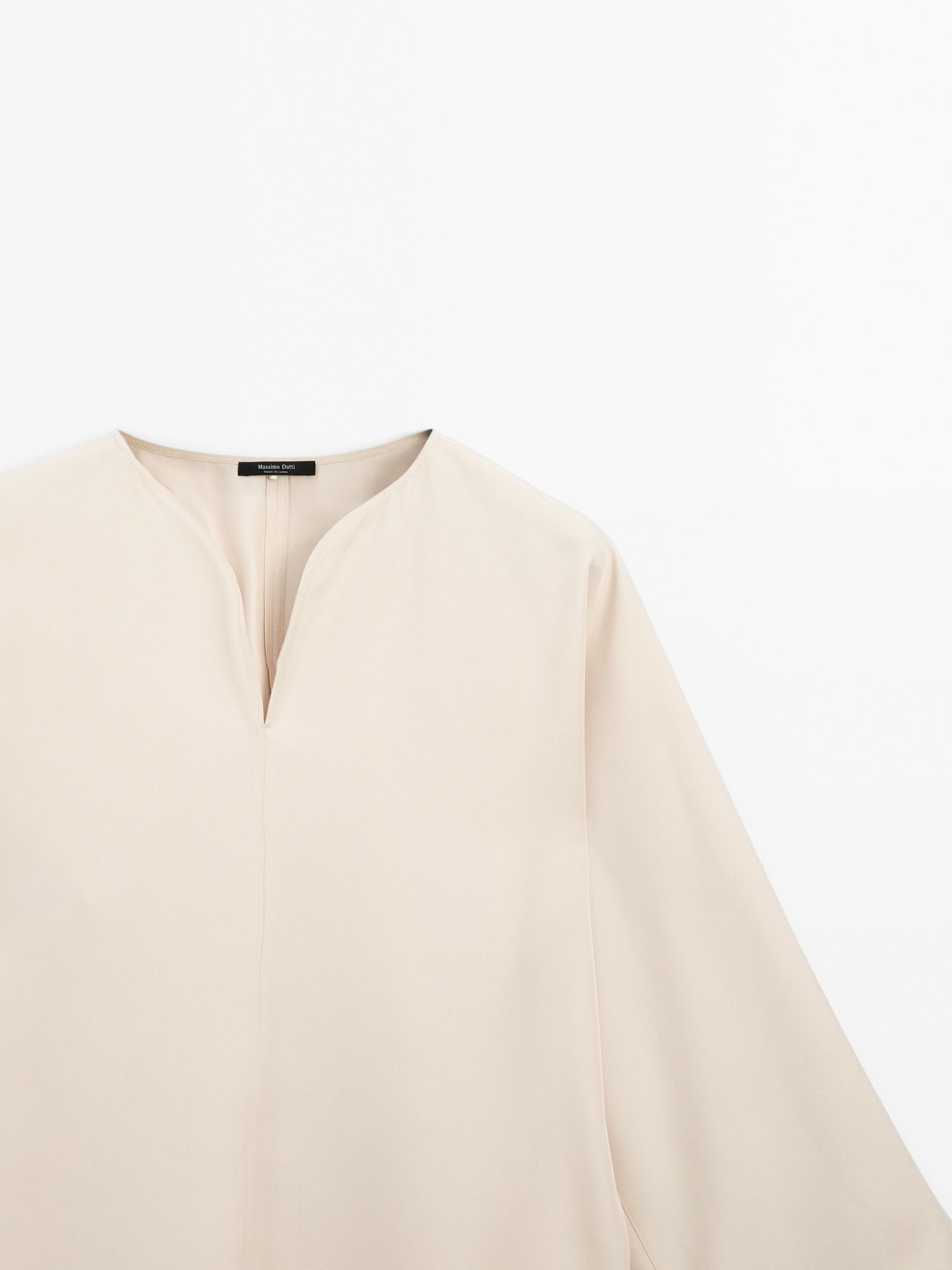 Flowing blouse with slit details
