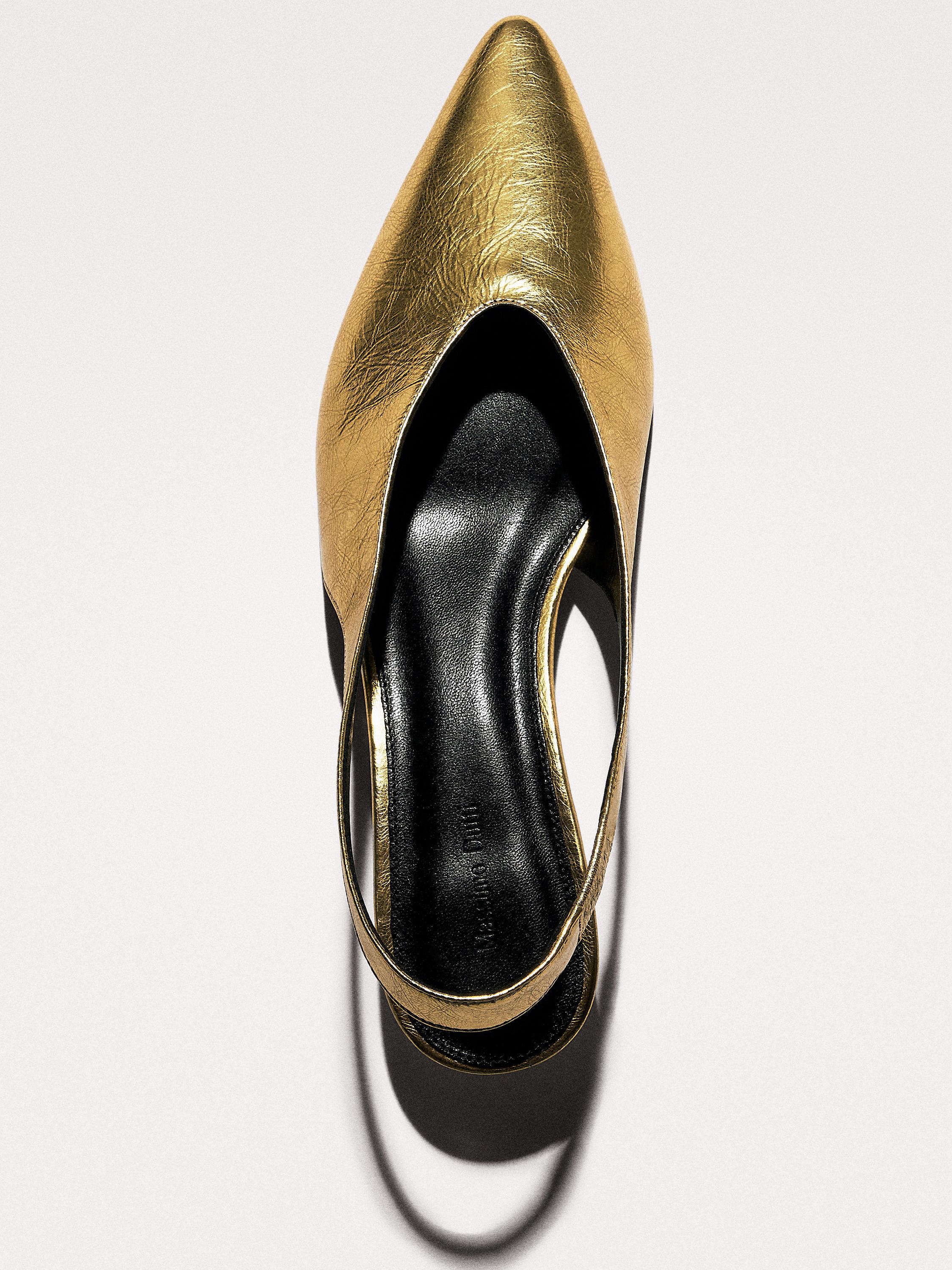 Gold high-heel slingback shoes