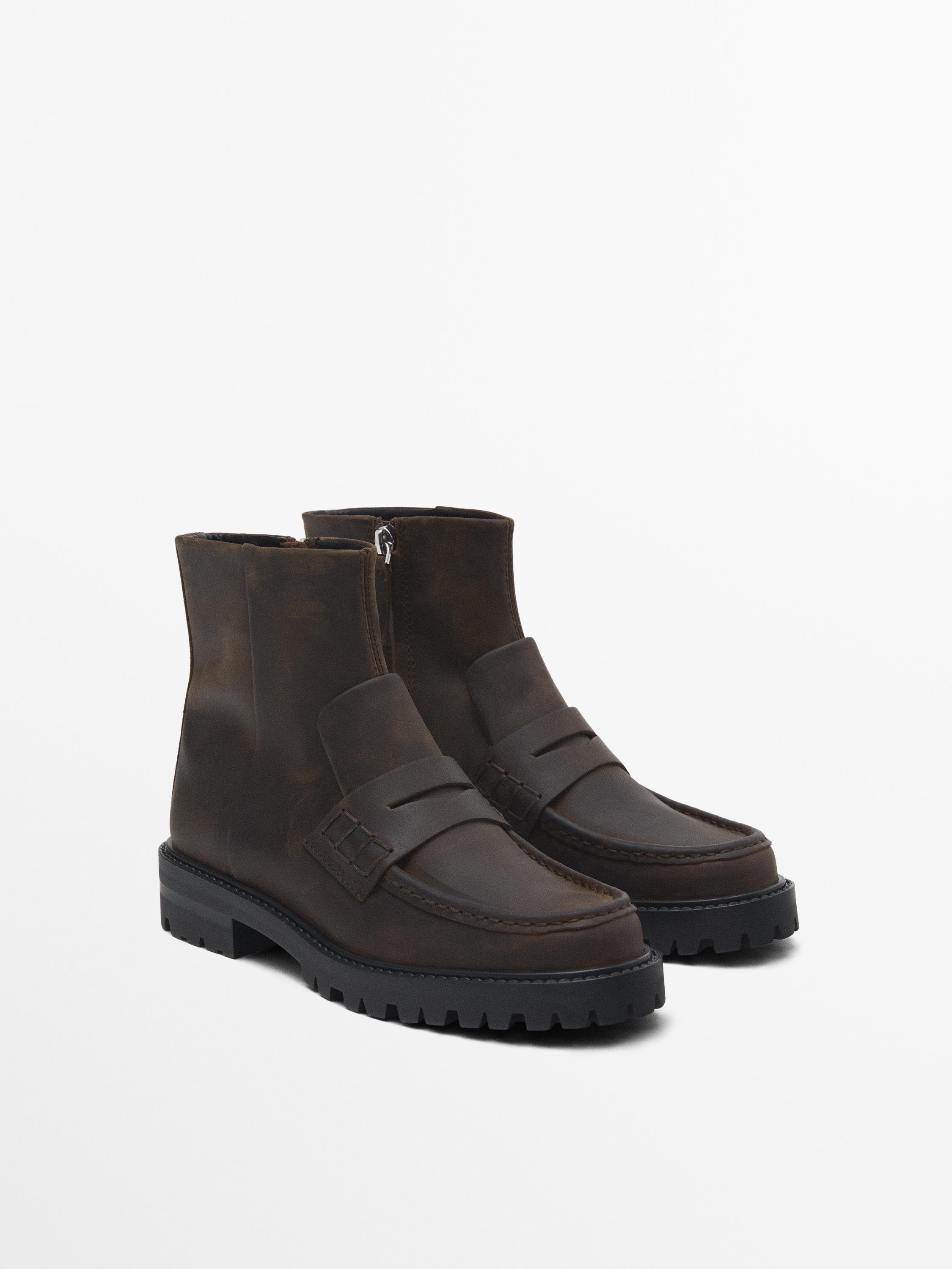 Track sole ankle boots with penny strap
