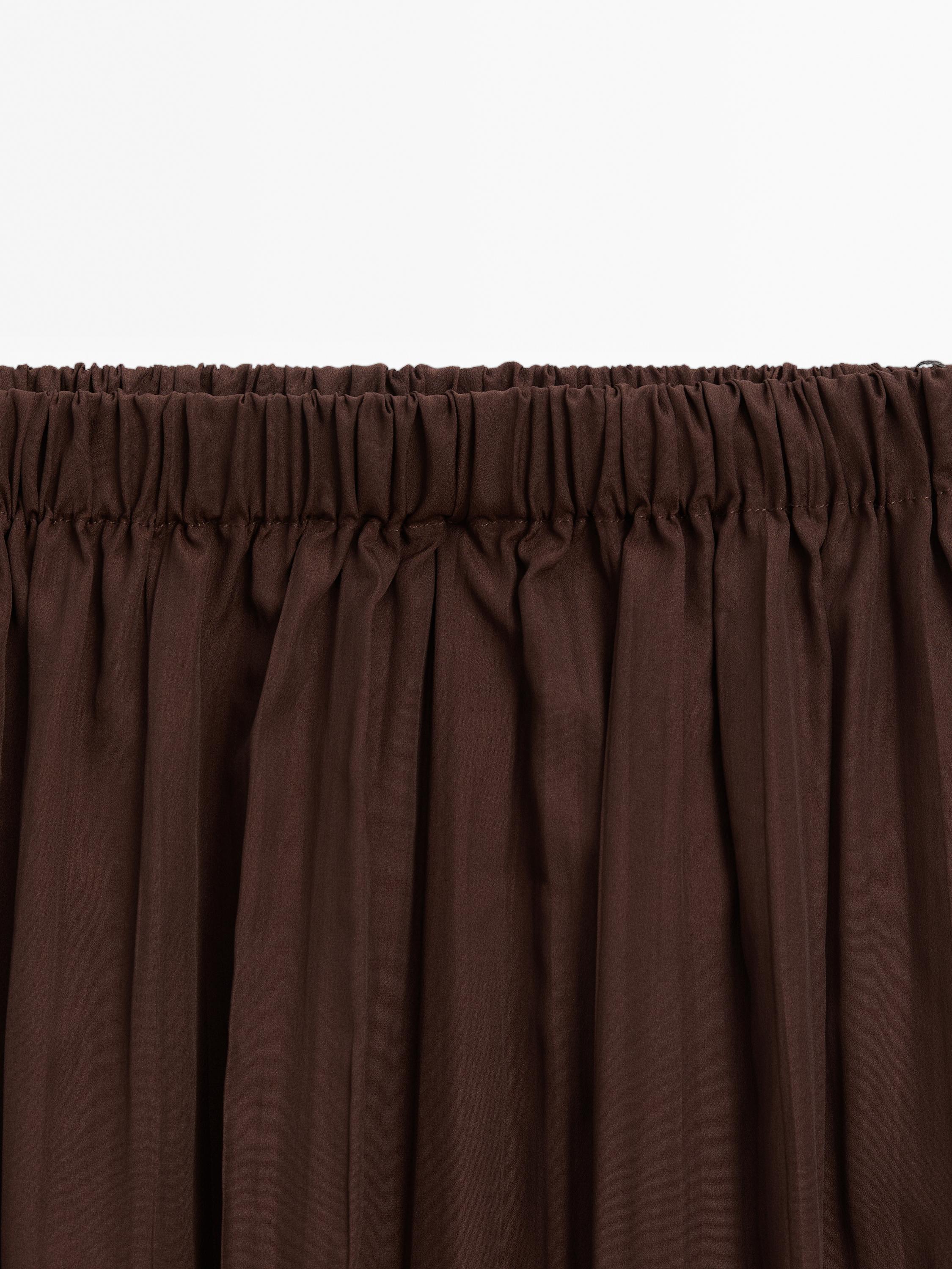 Long flowing pleated skirt