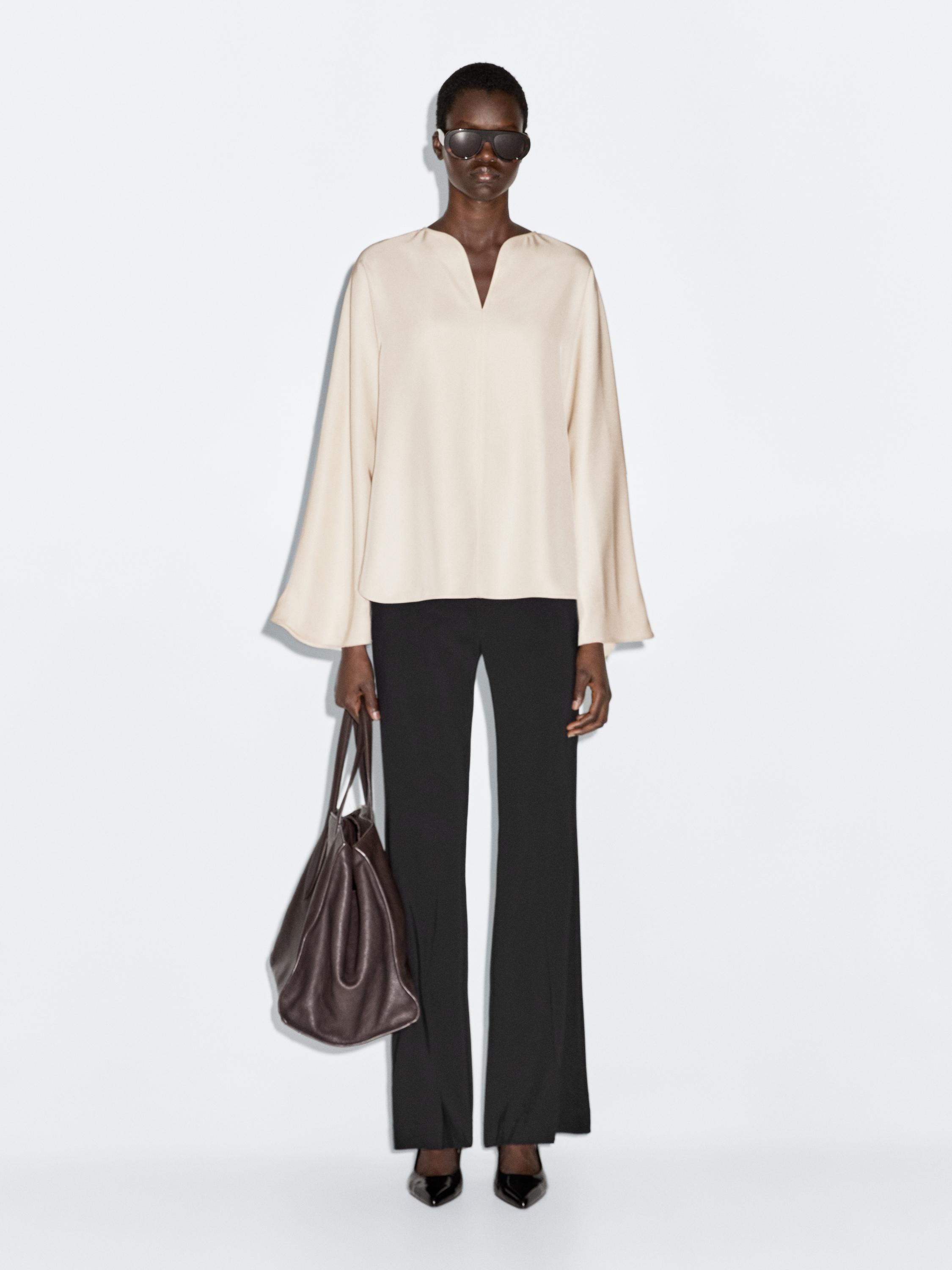 Blusa fluida detalle aberturas