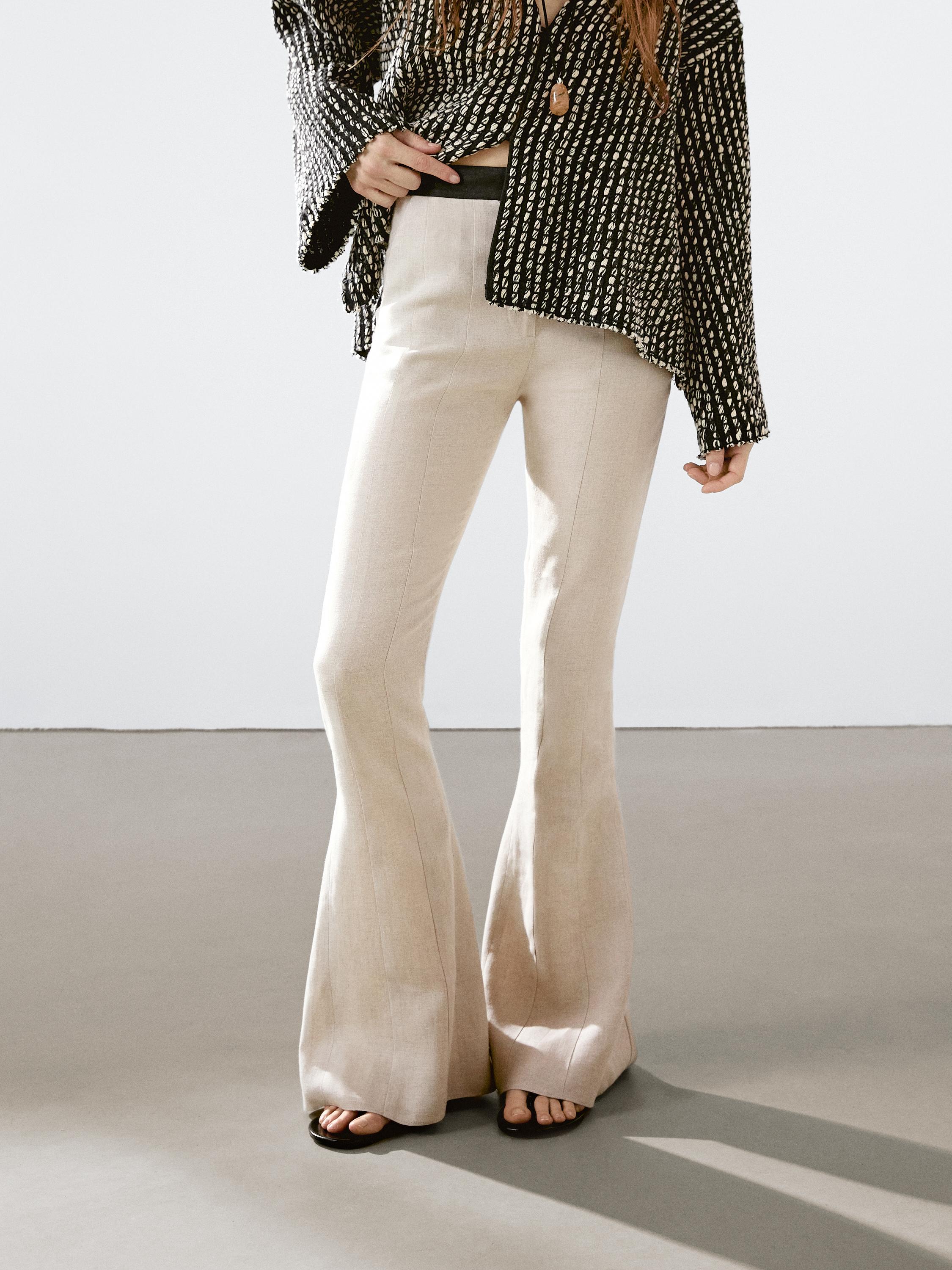 Flared trousers with contrast waist
