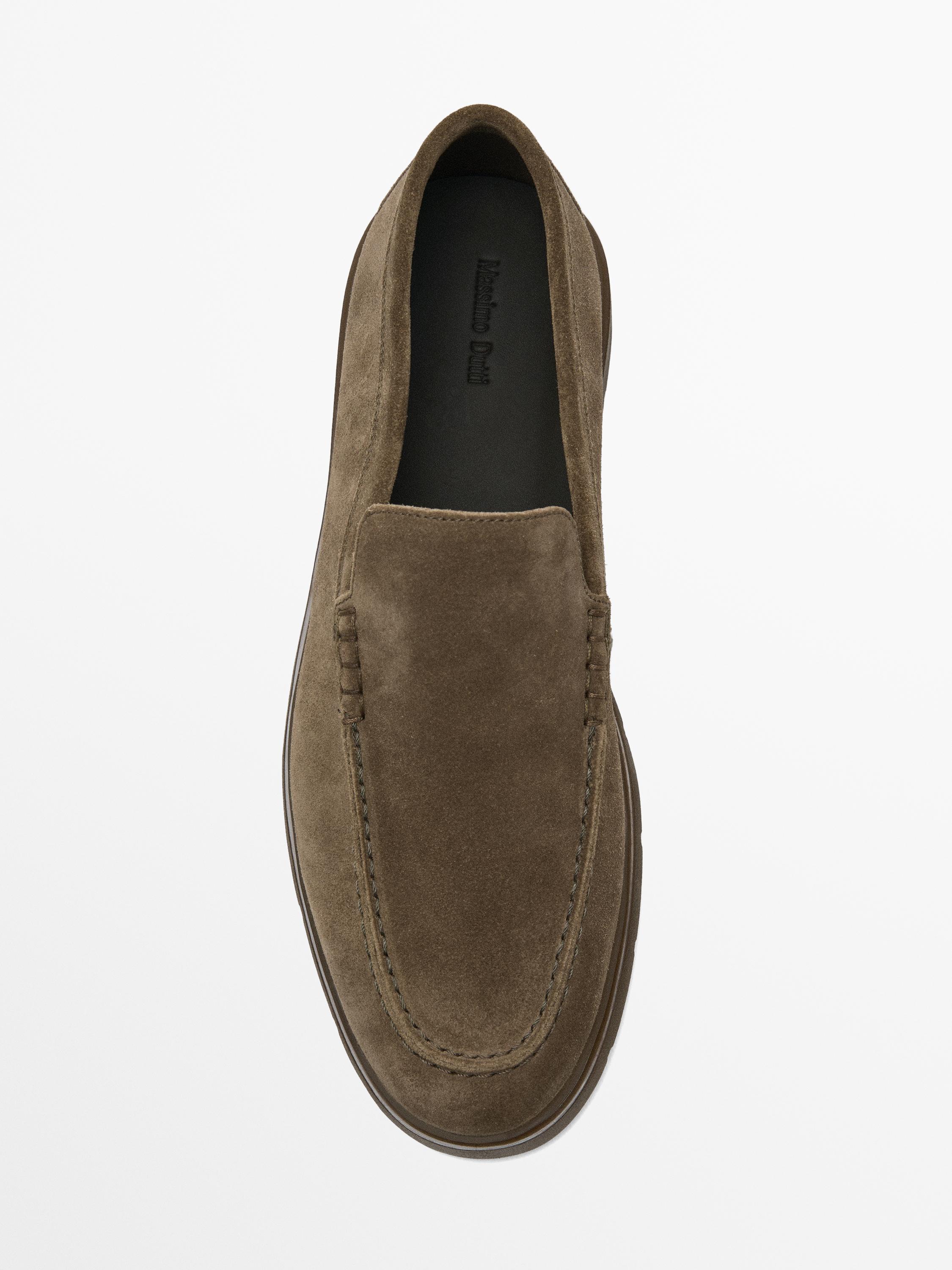 Top view of brown loafer with visible stitching.
