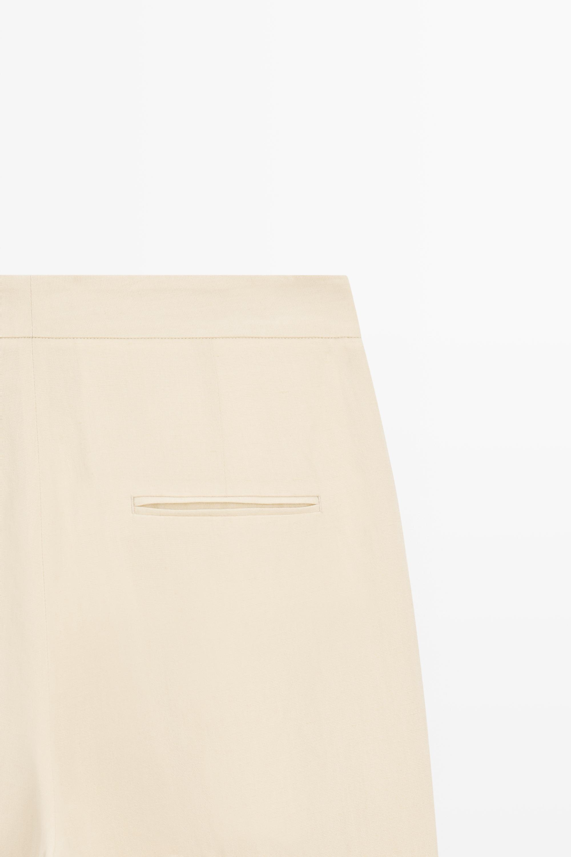 Flowing trousers with pleats — Beige
