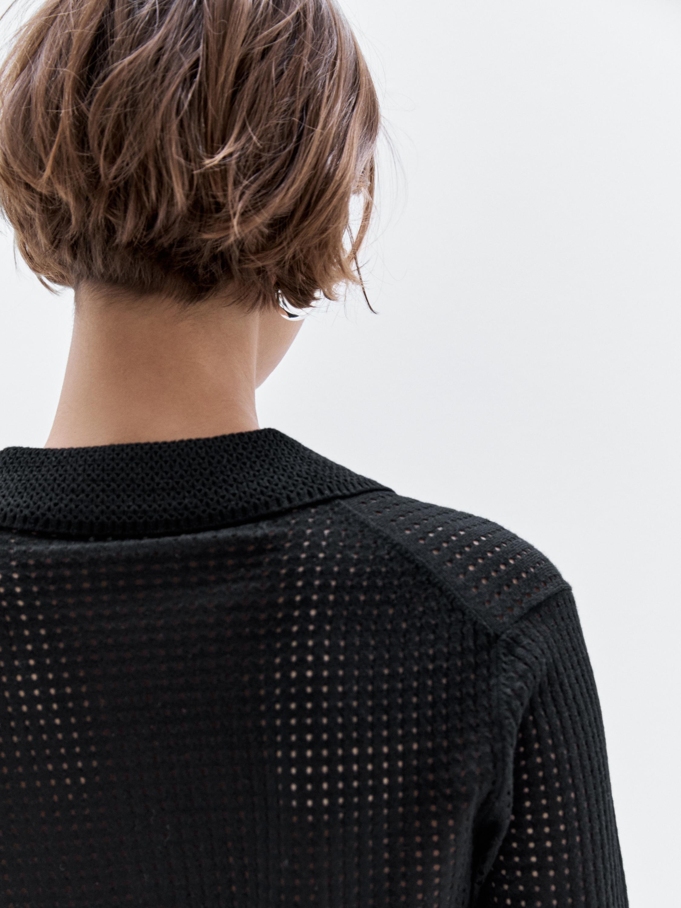 Open knit sweater with polo collar