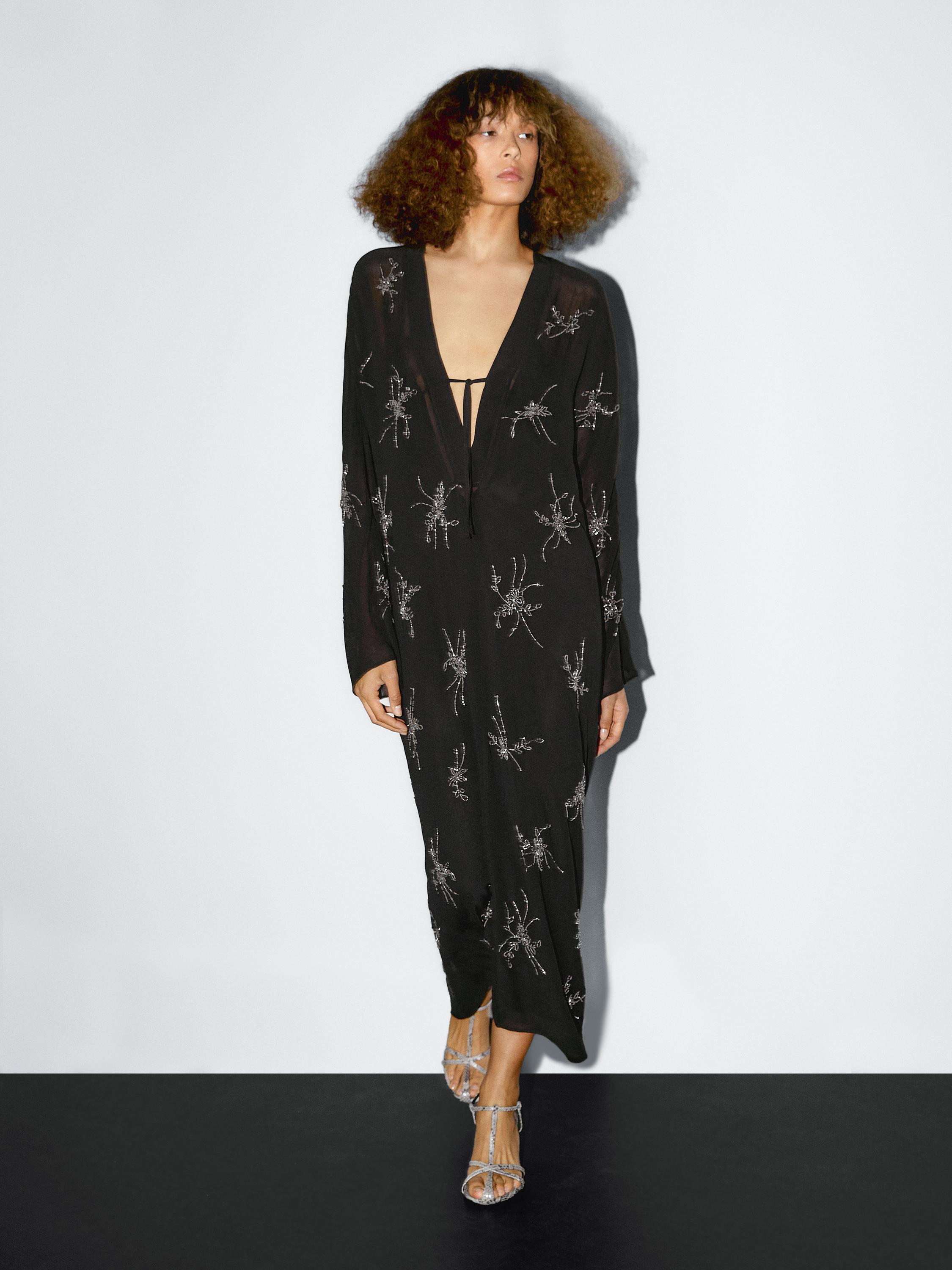 Flowing midi dress with embroidery
