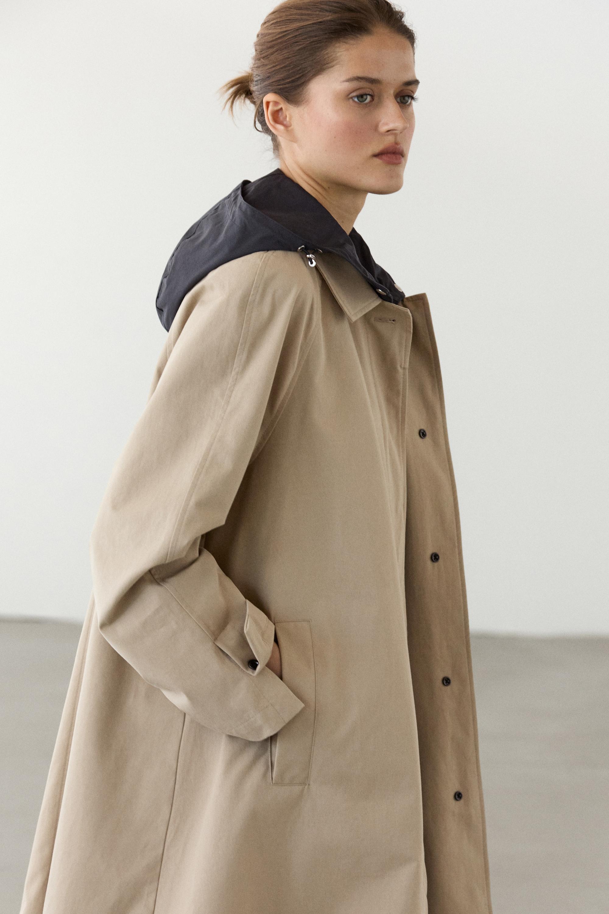 Cape trench coat with detachable hood