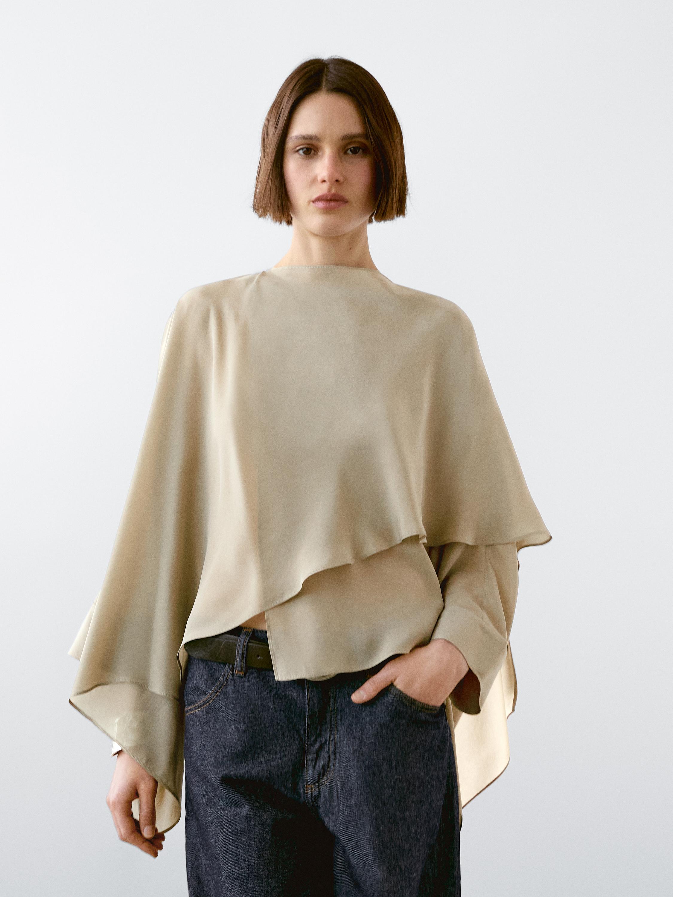 Flowing cape with a satin finish