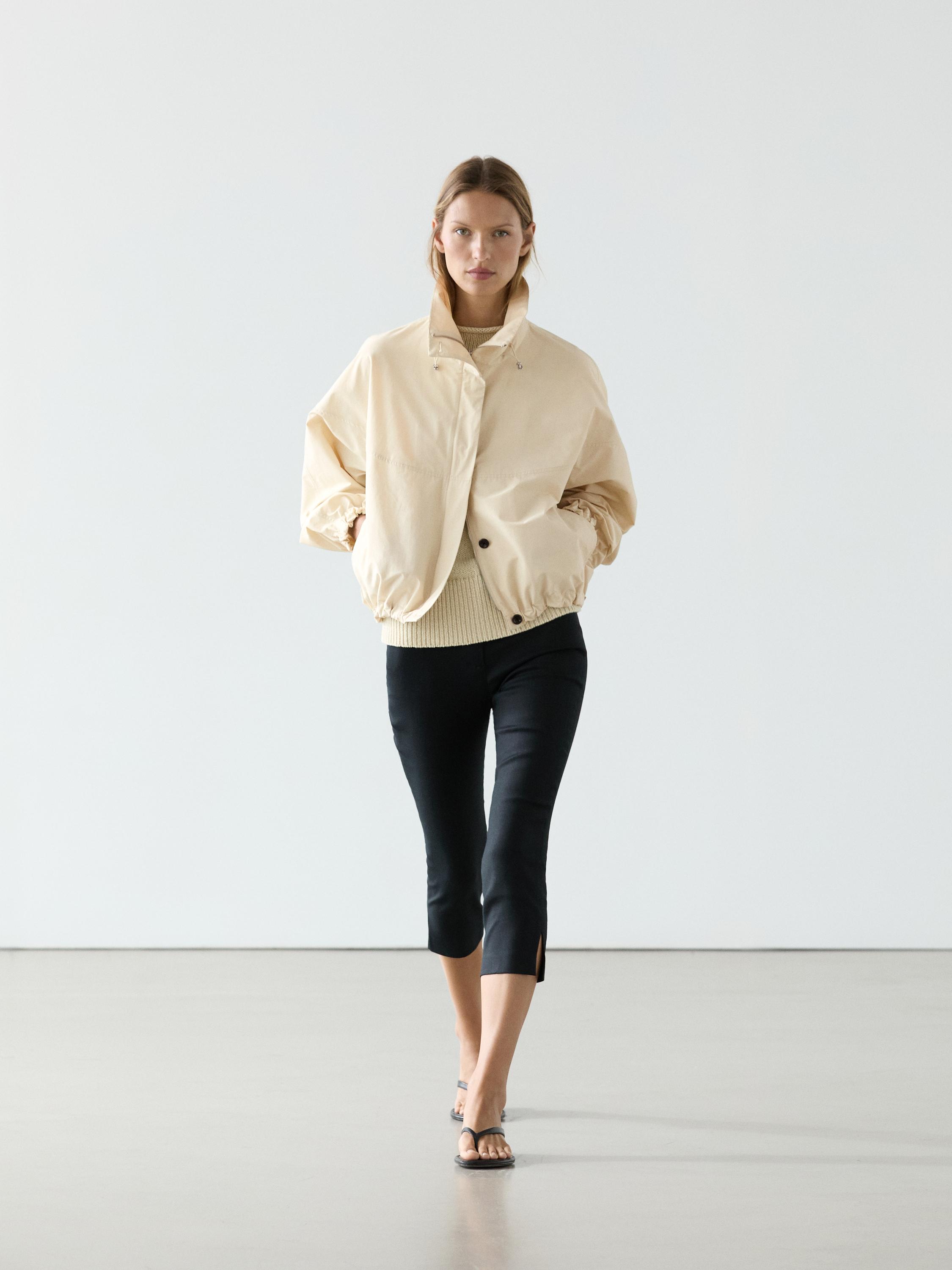 Chaqueta bomber abullonada cuello alto