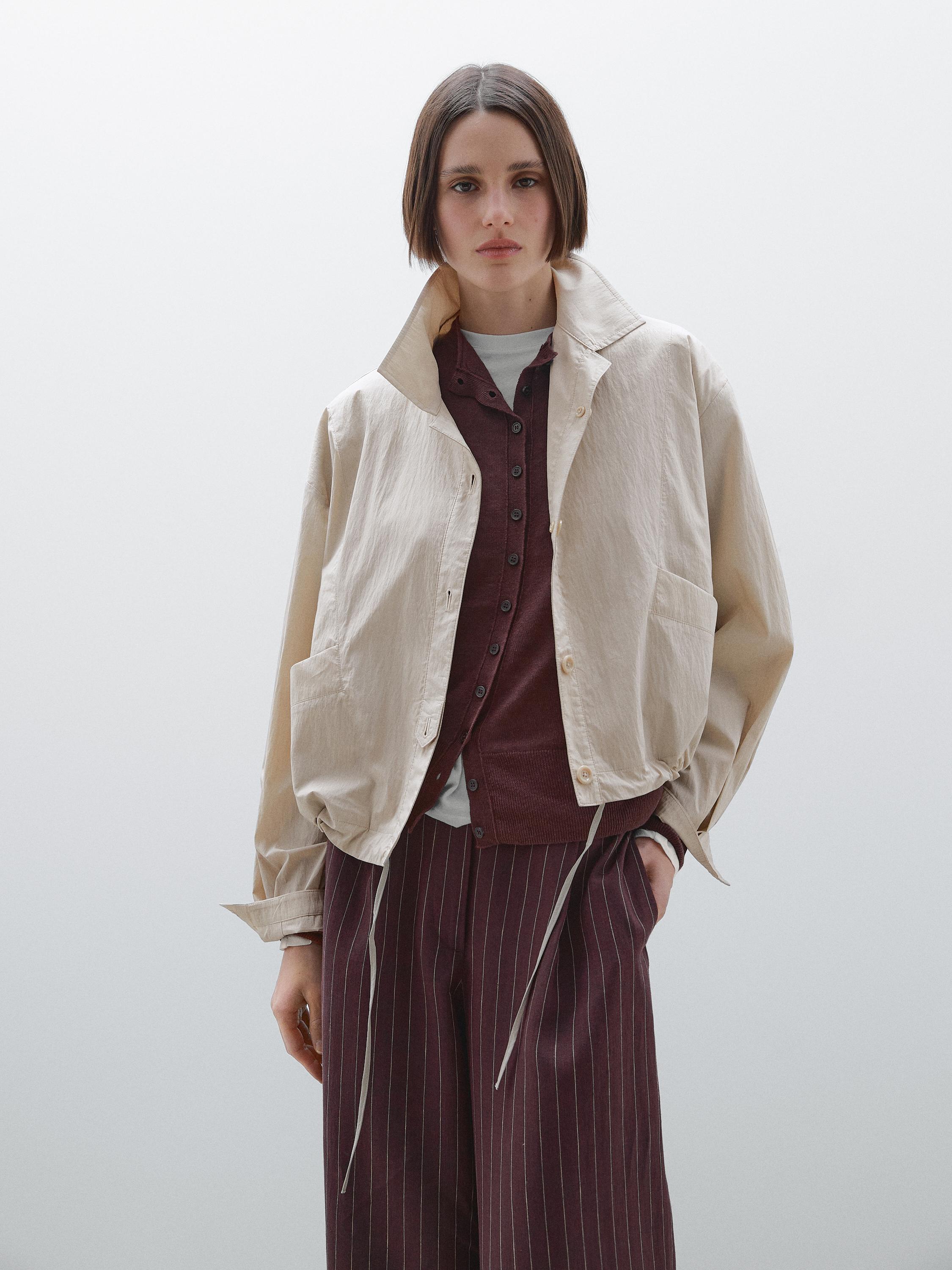Bomber jacket with seams and gathering