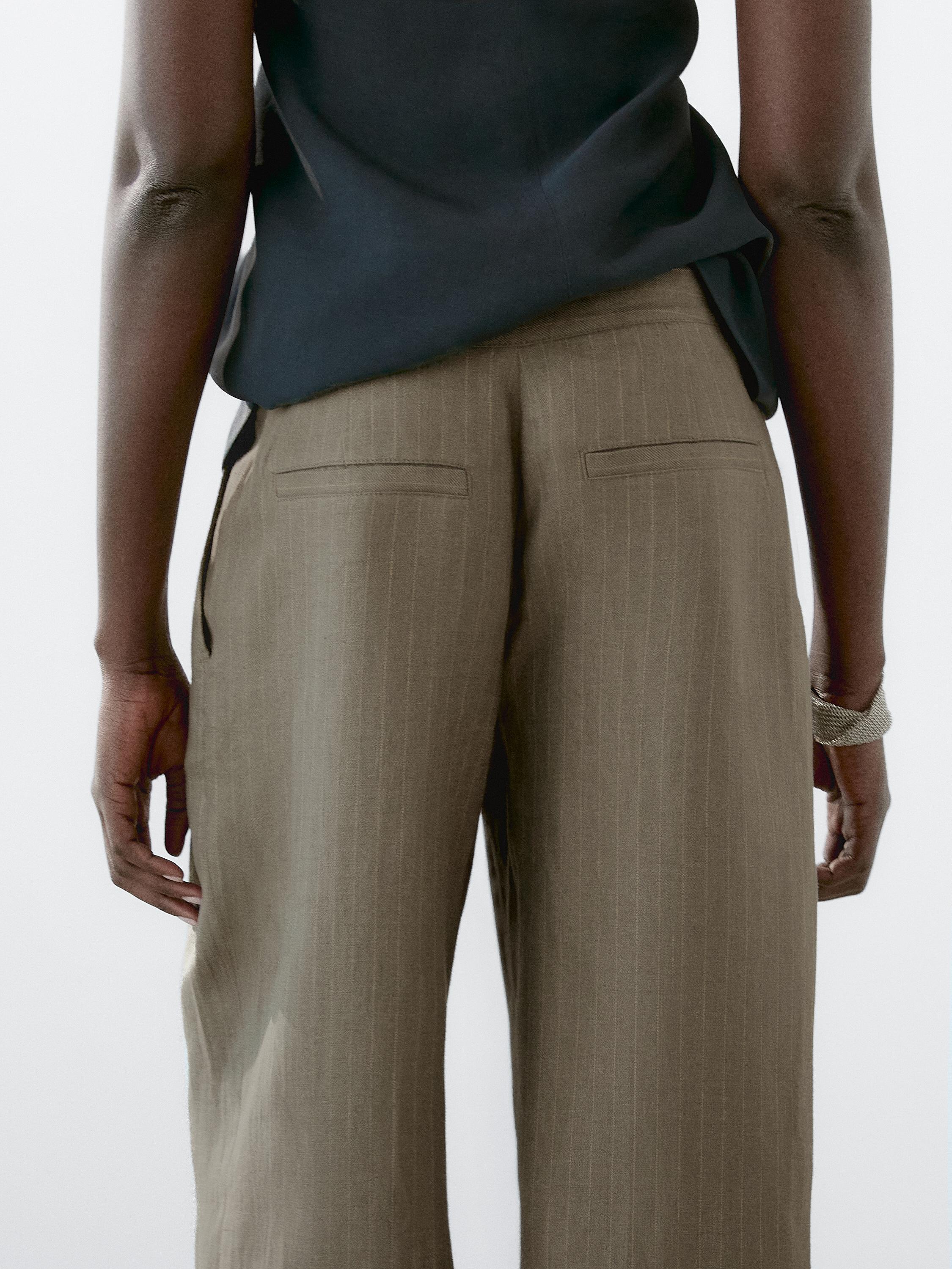 100% linen striped trousers with buckle detail