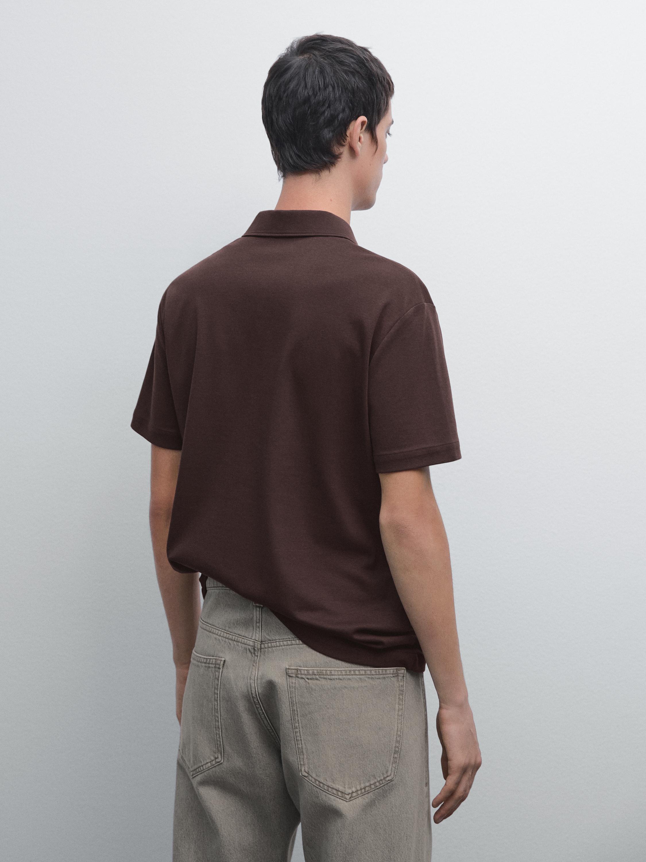 Polo à manches courtes et patte pressionnée