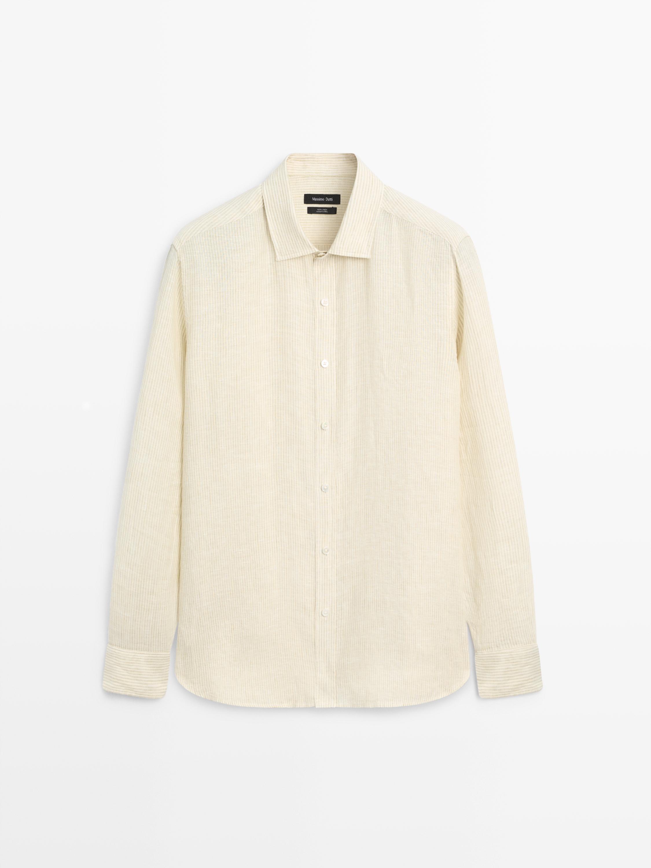Front view of a beige shirt with a classic collar, central buttons, and long sleeves.