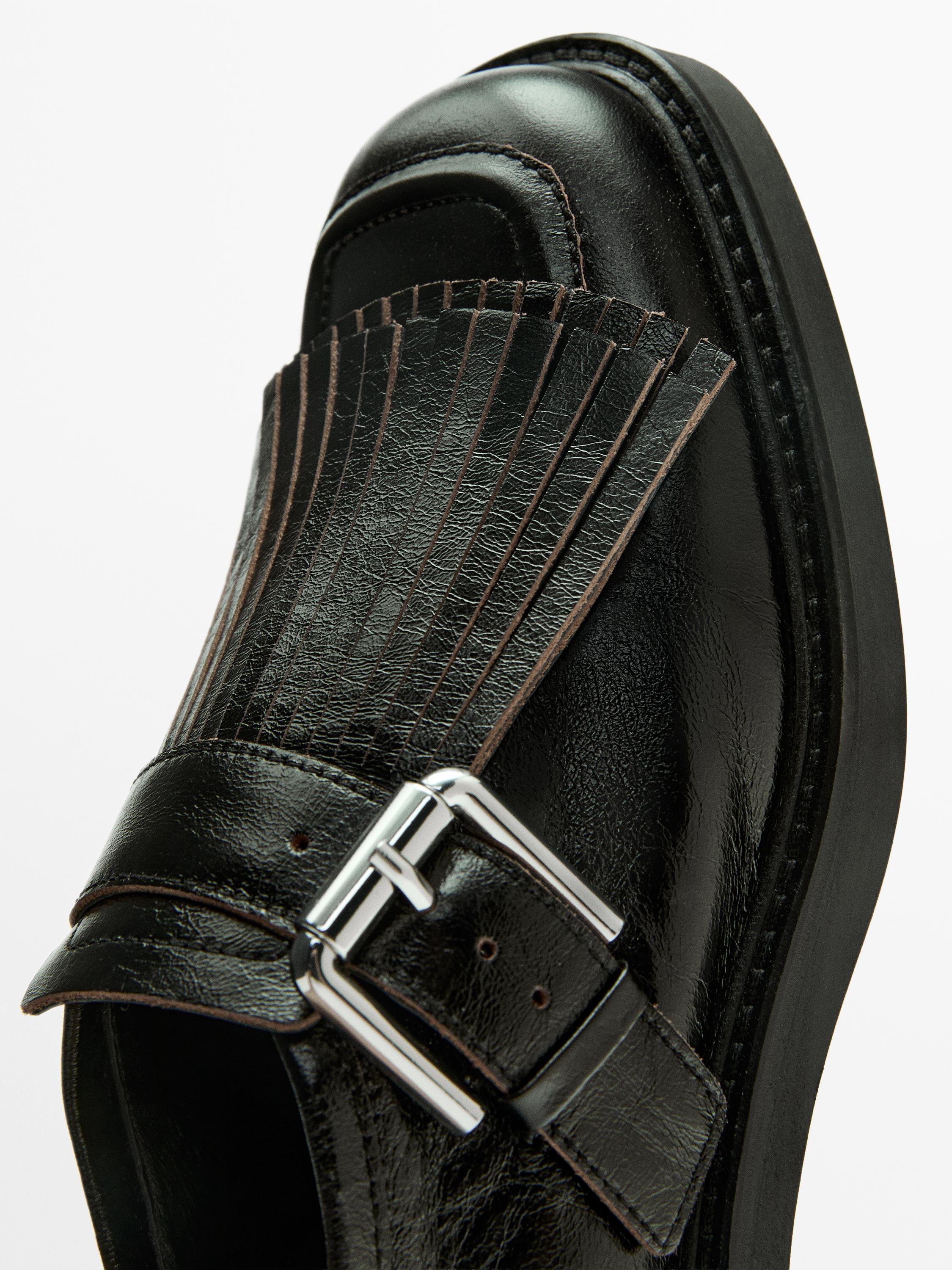 Buckled derby shoes with fringe — BLACK