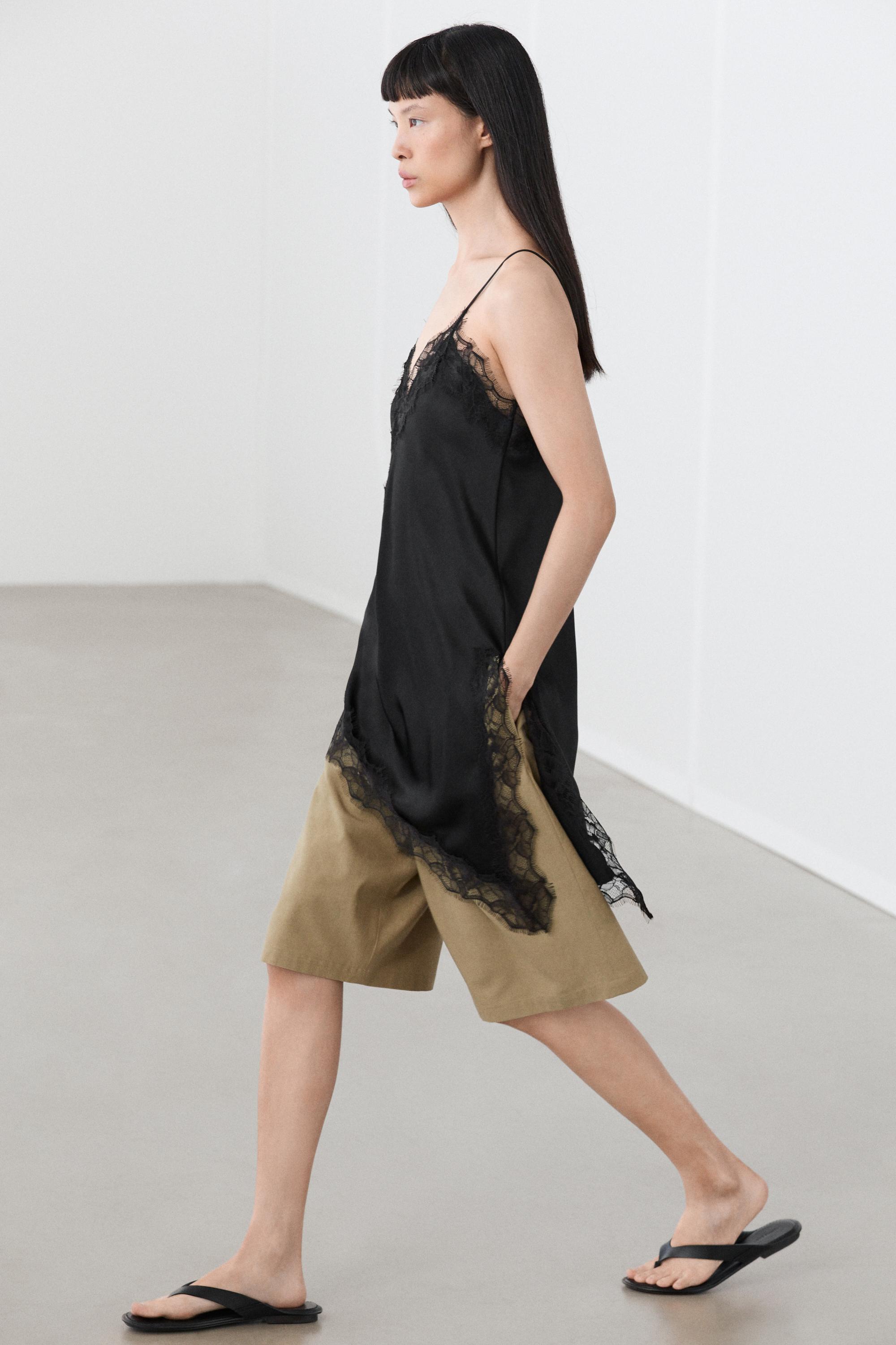 Asymmetric thin strap camisole top — BLACK