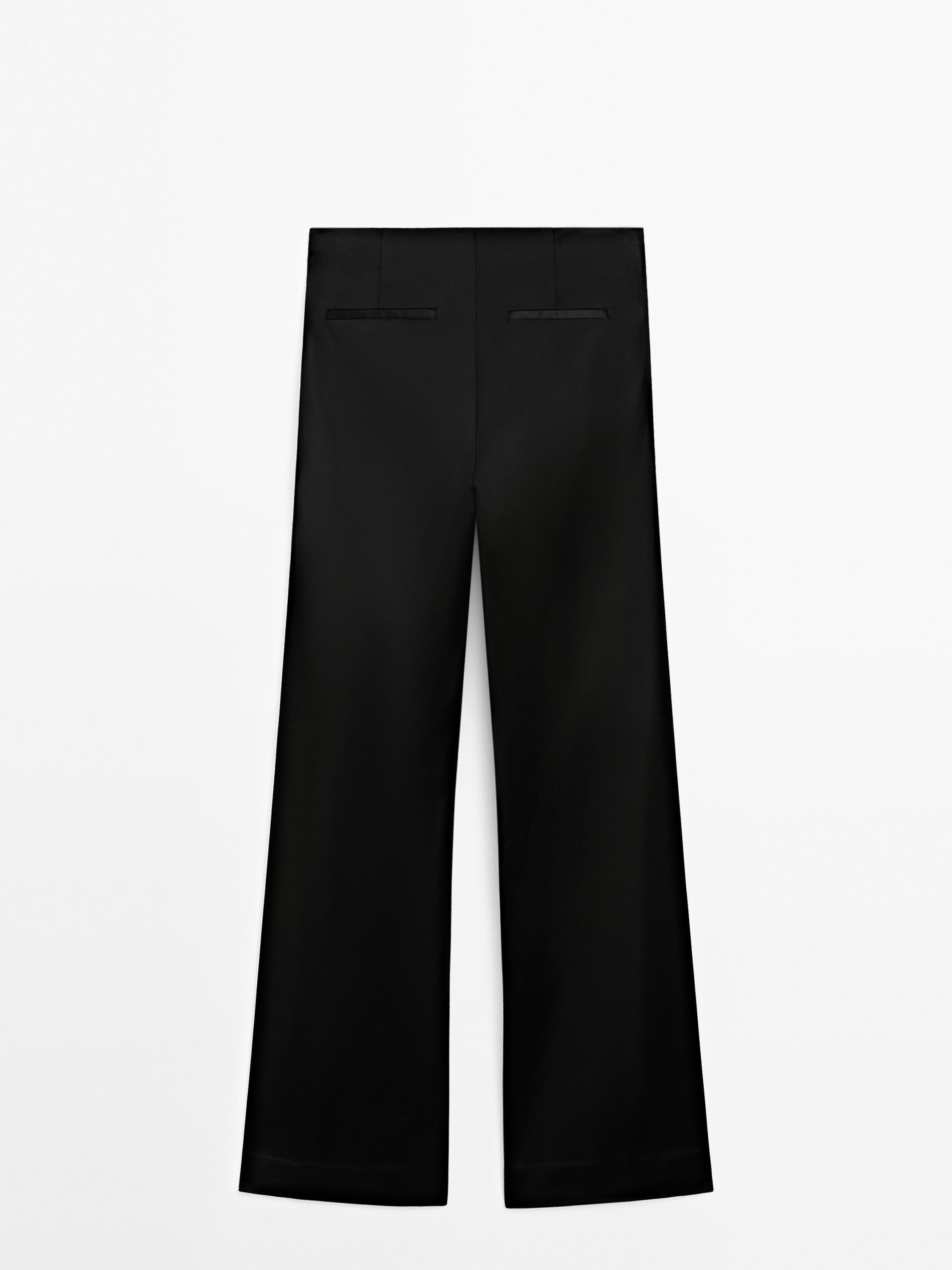 Pantalón flare satinado aberturas