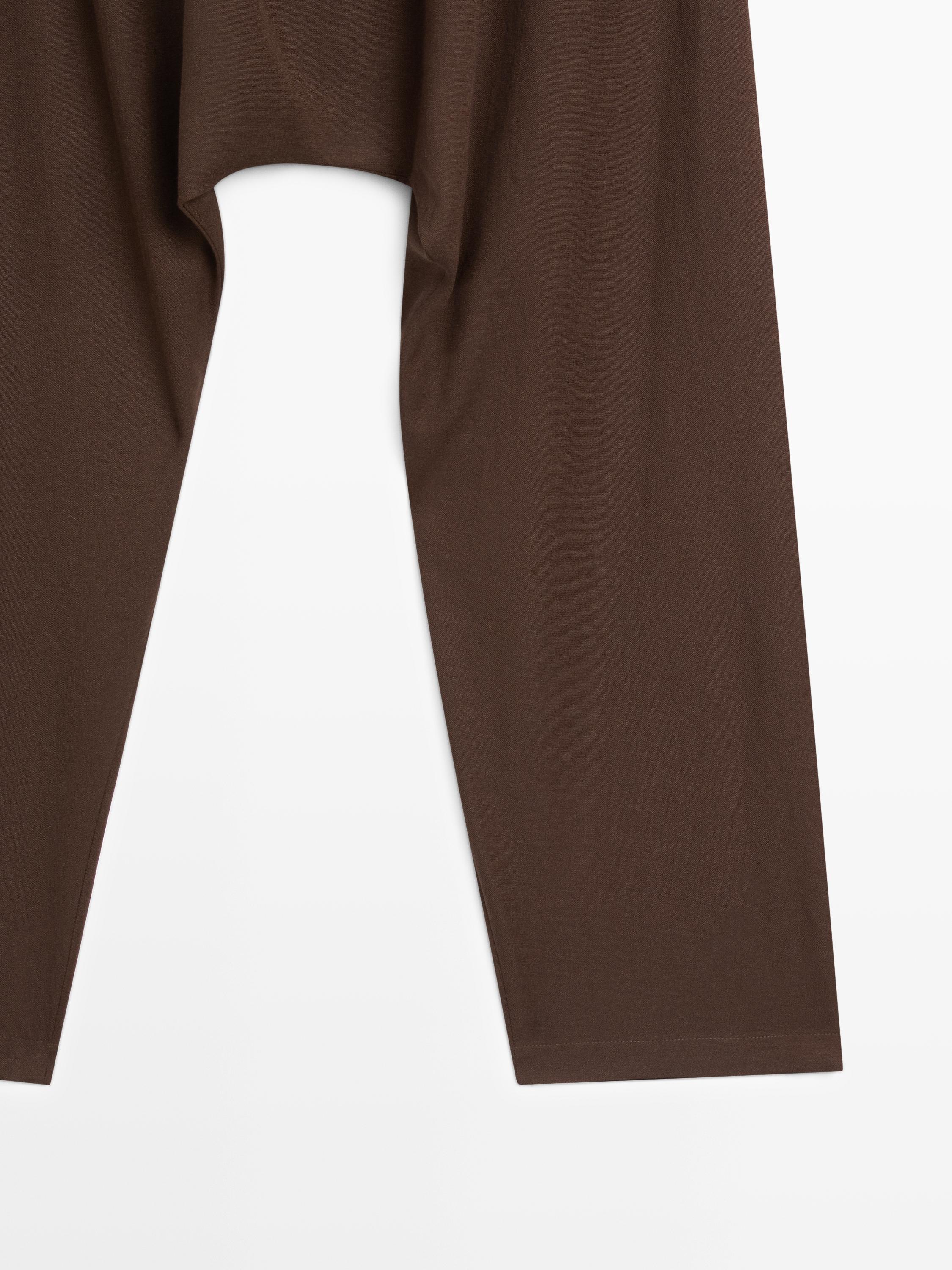 Baggy trousers with pleated details — BROWN