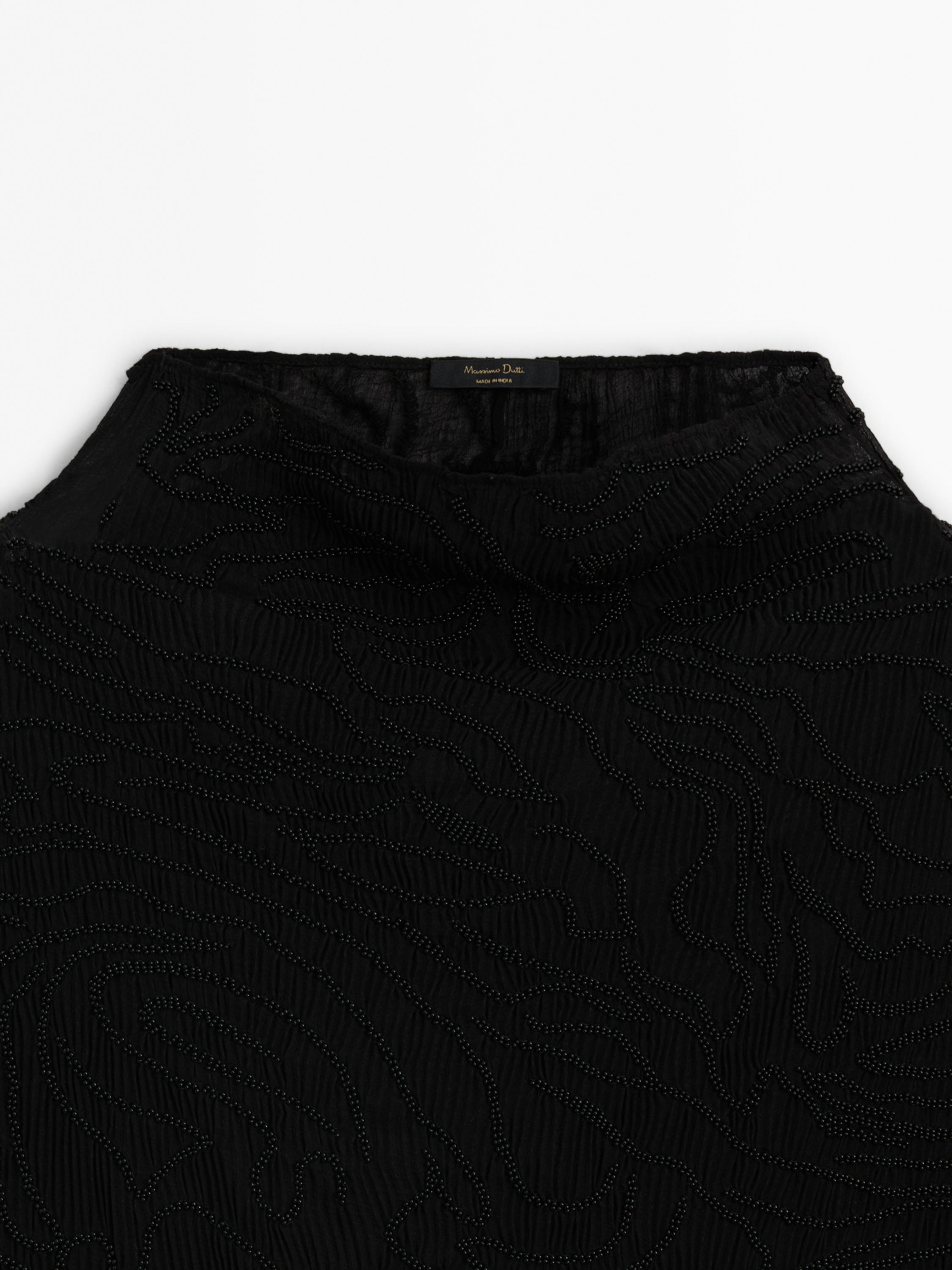 Top detalle abalorios