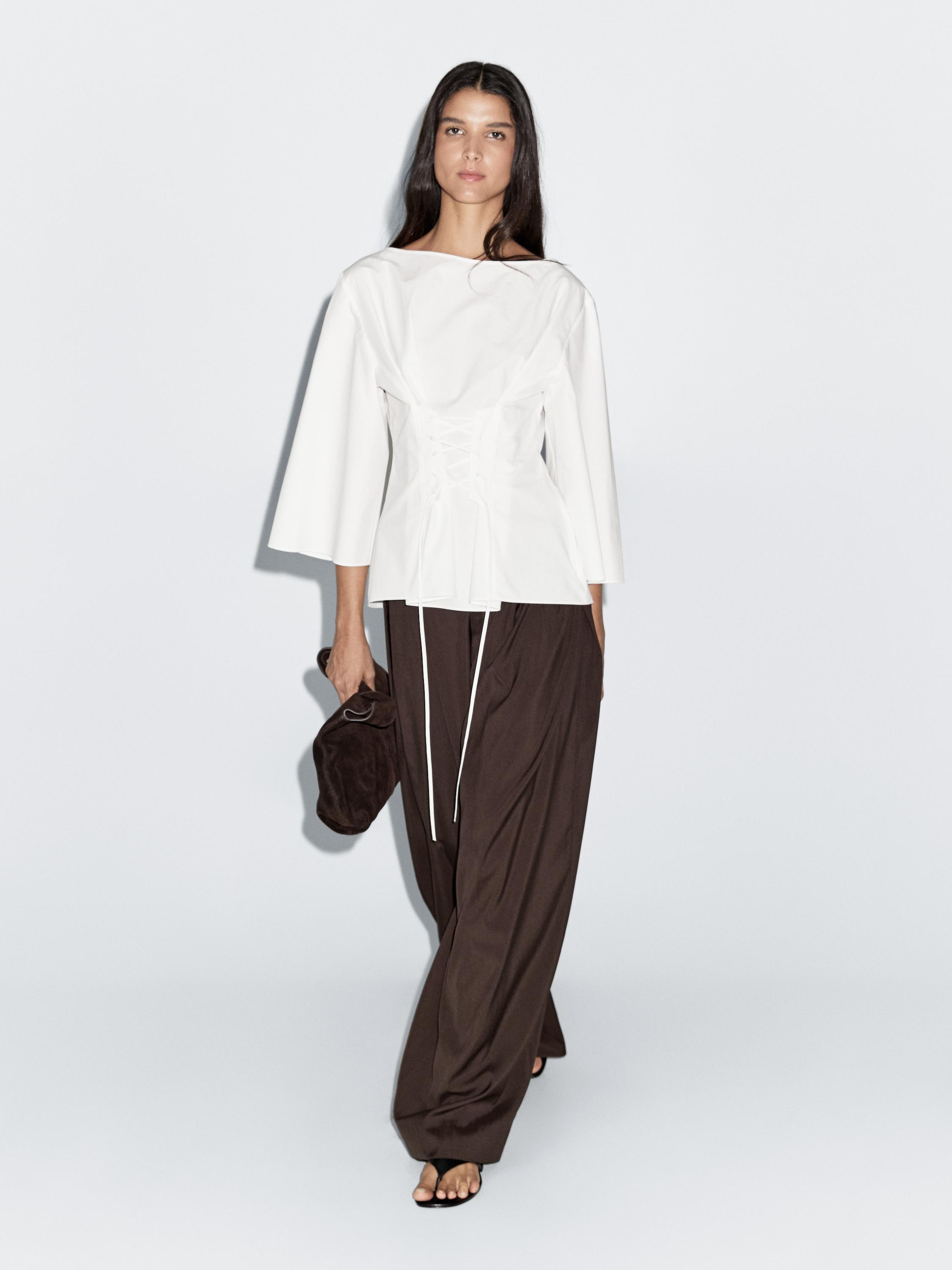 Blouse with corset detail