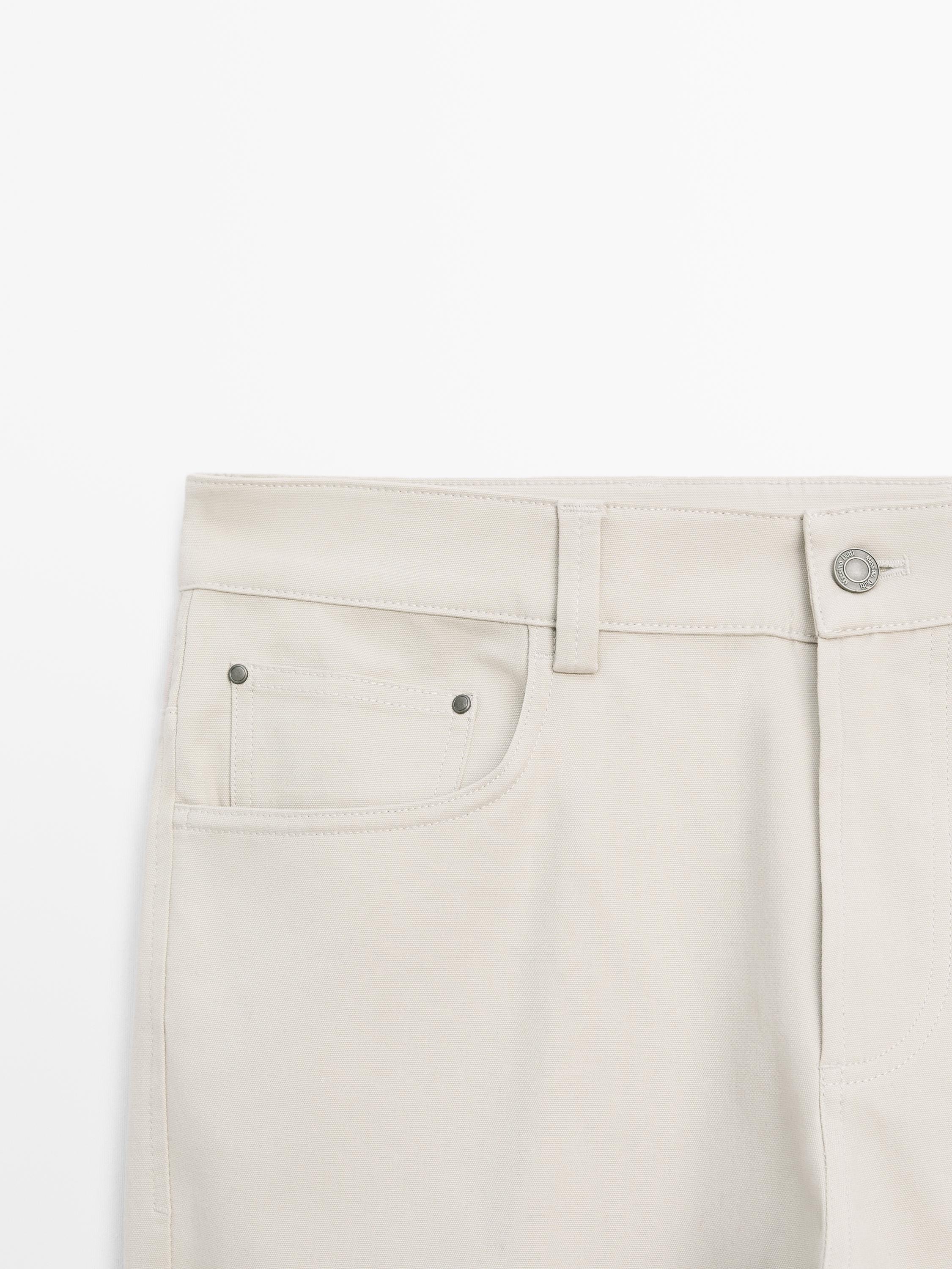 Cotton blend tapered fit jeans