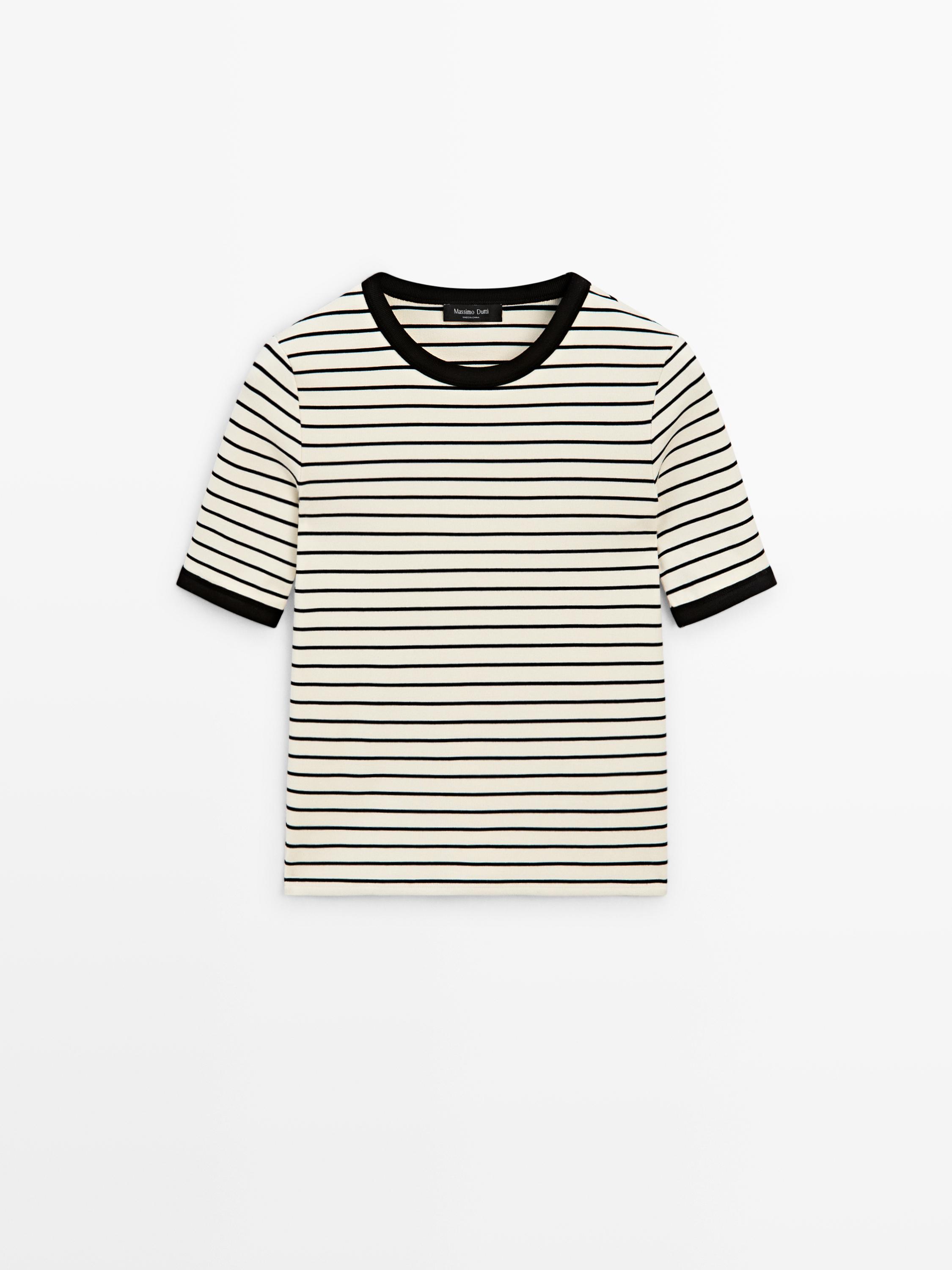 Front view of a white t-shirt with black stripes, short sleeves, and black trim on the collar and sleeves.