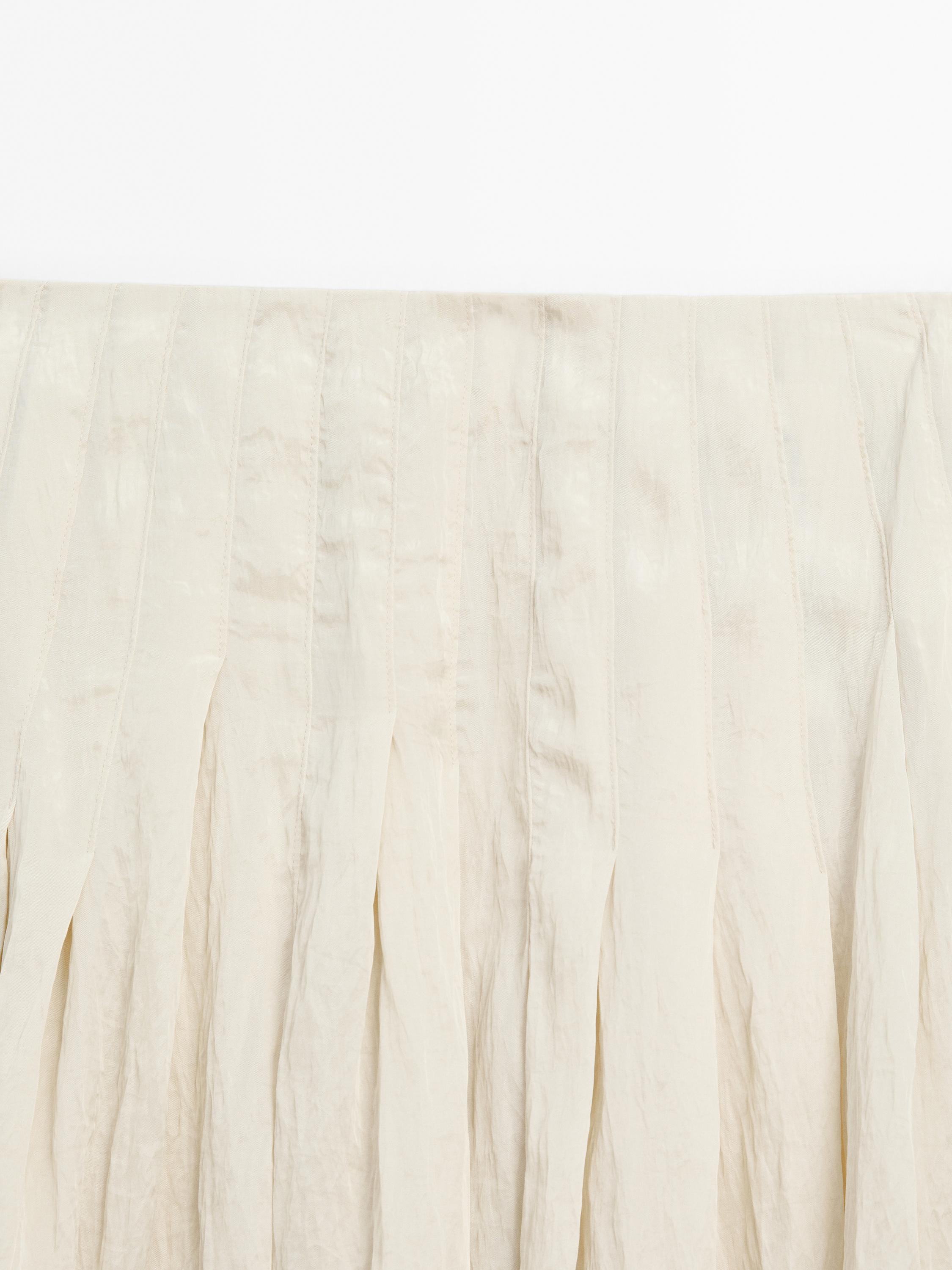 Flowing midi skirt with box pleats