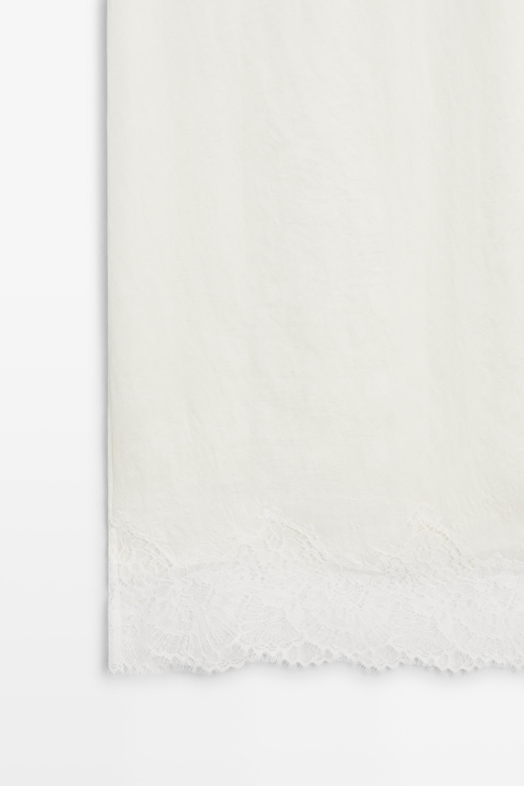 Flowing midi skirt with lace detail — WHITE