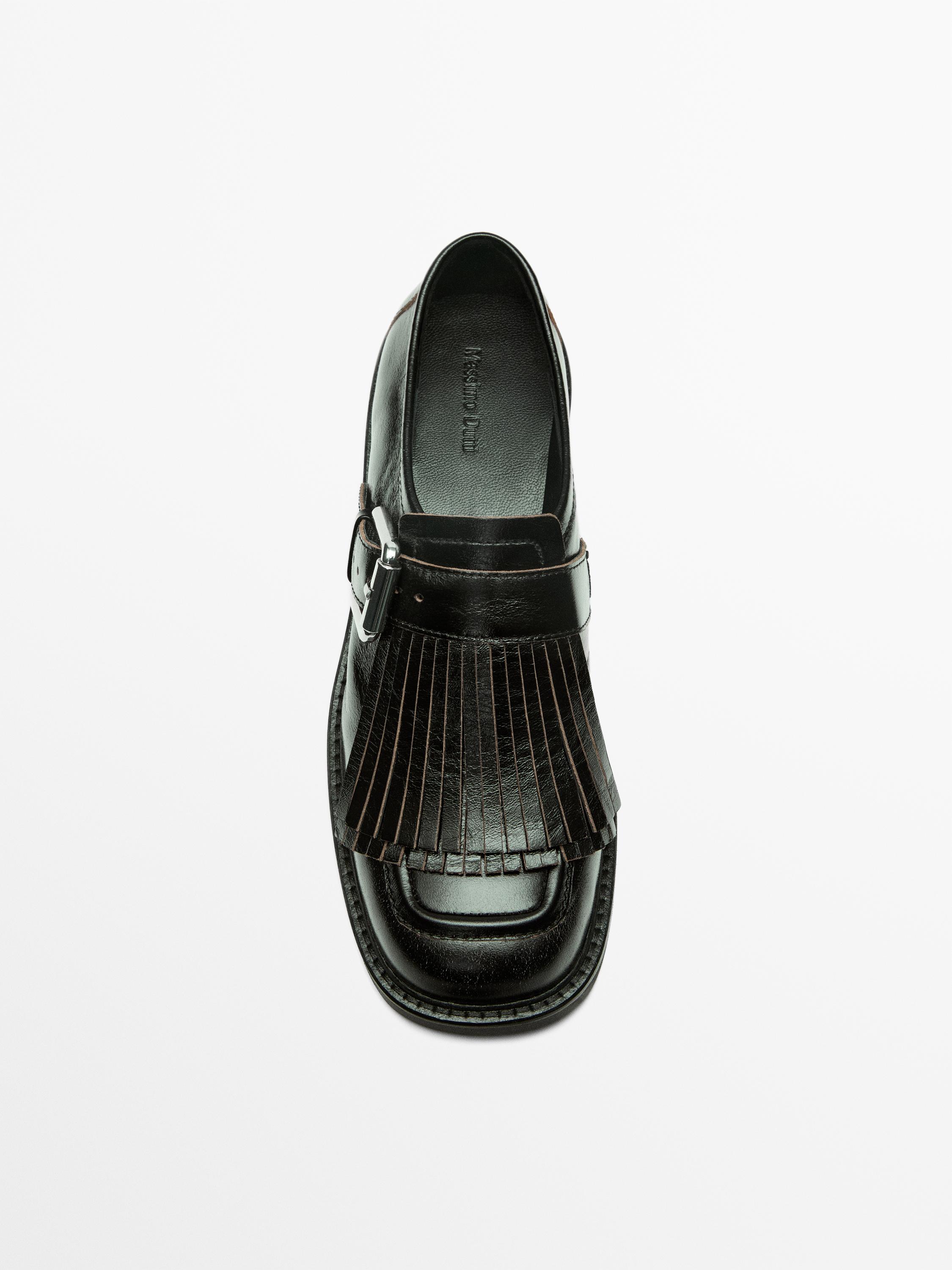 Buckled derby shoes with fringe — BLACK