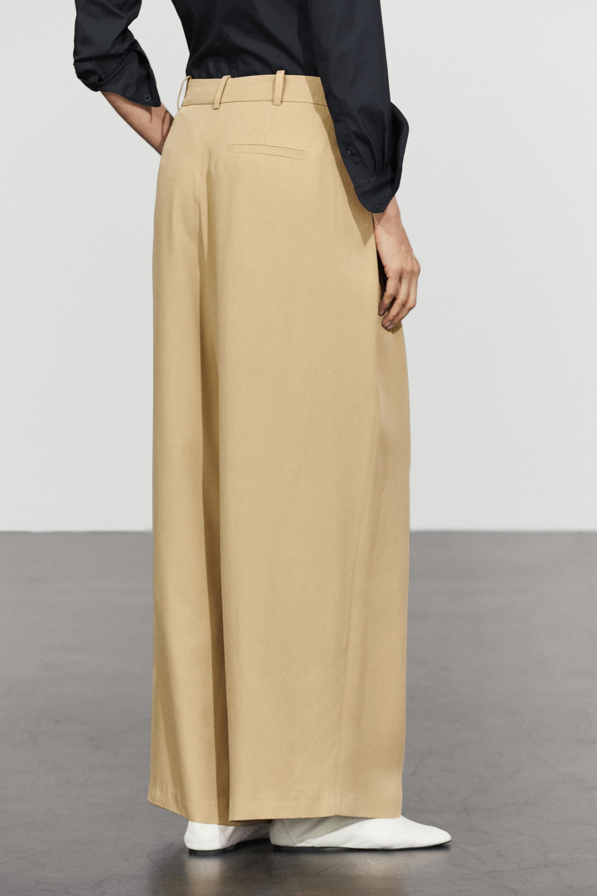 Flowing pleated pants with button detail — BEIGE