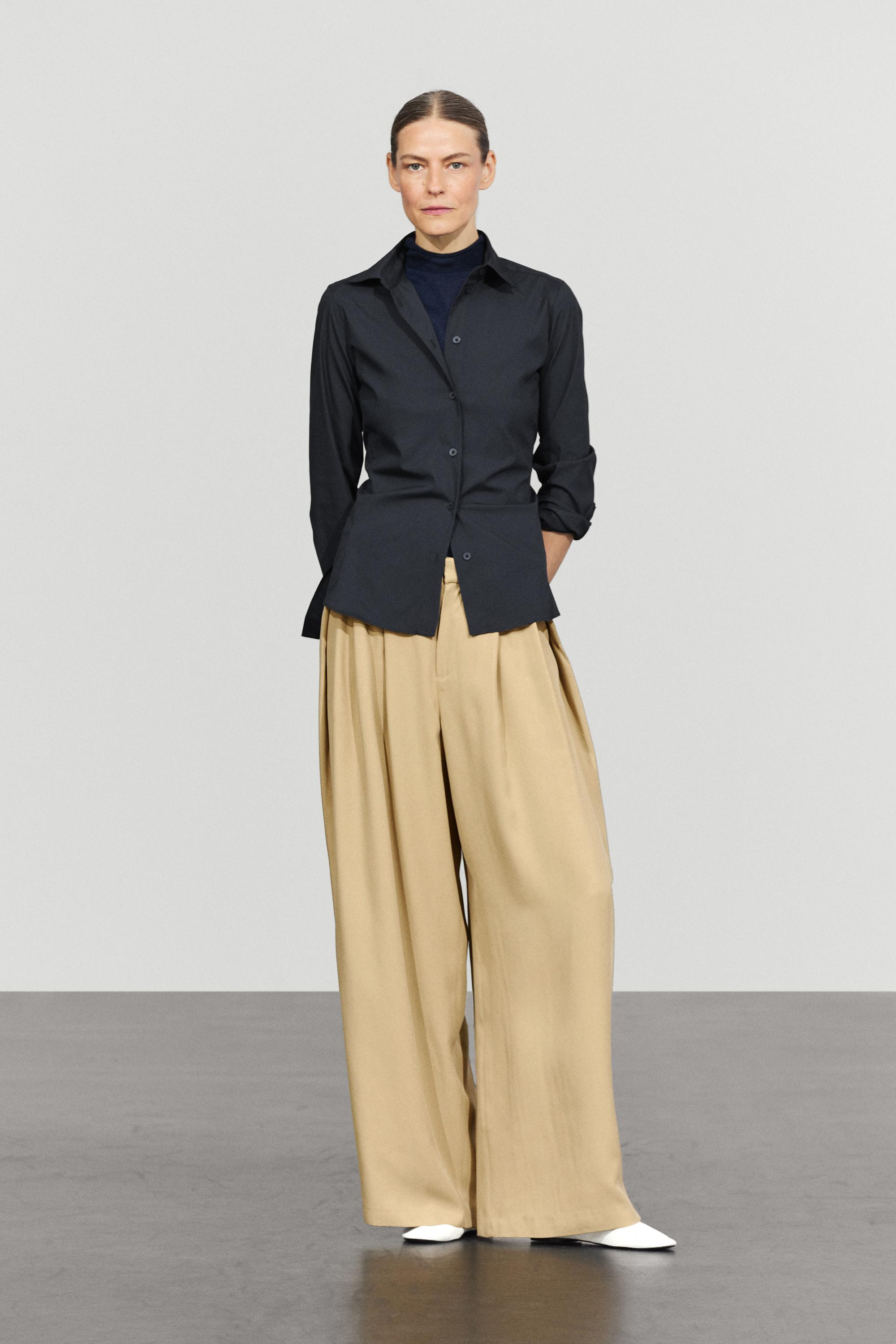 Flowing pleated pants with button detail — BEIGE