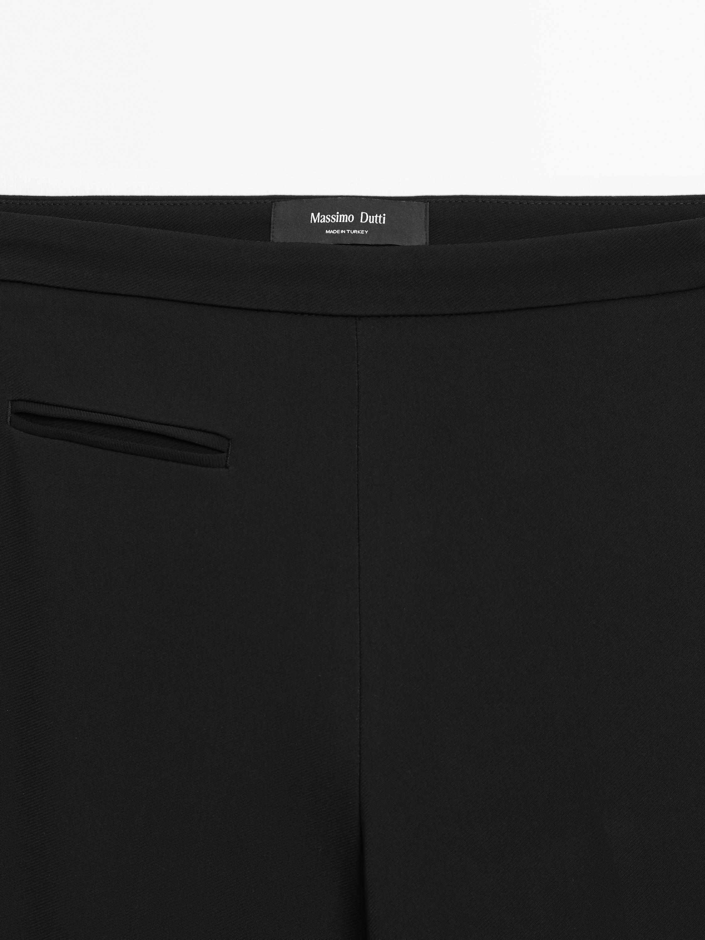 Flared trousers with pocket — BLACK