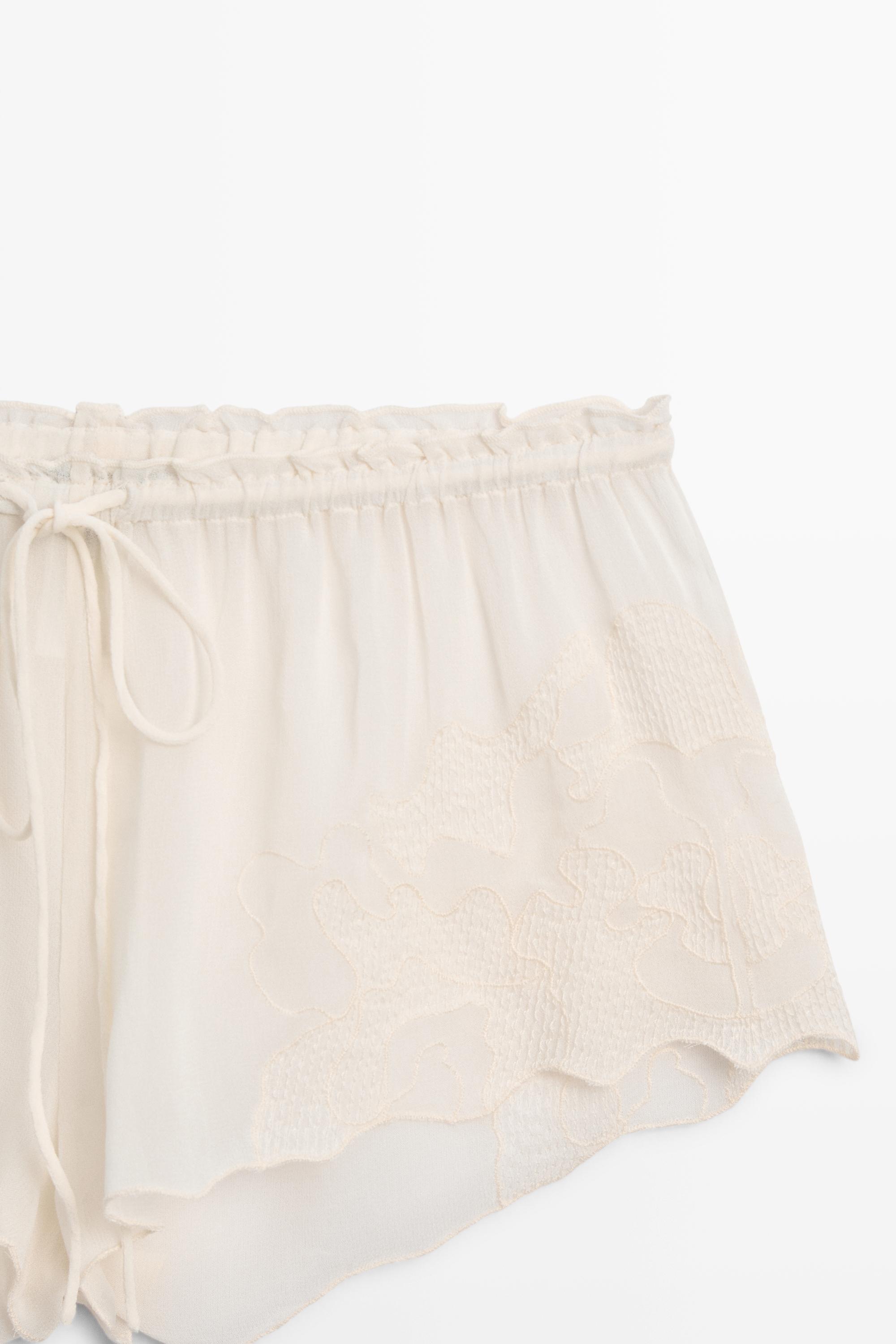 Flowing shorts with embroidered detail — CREAM