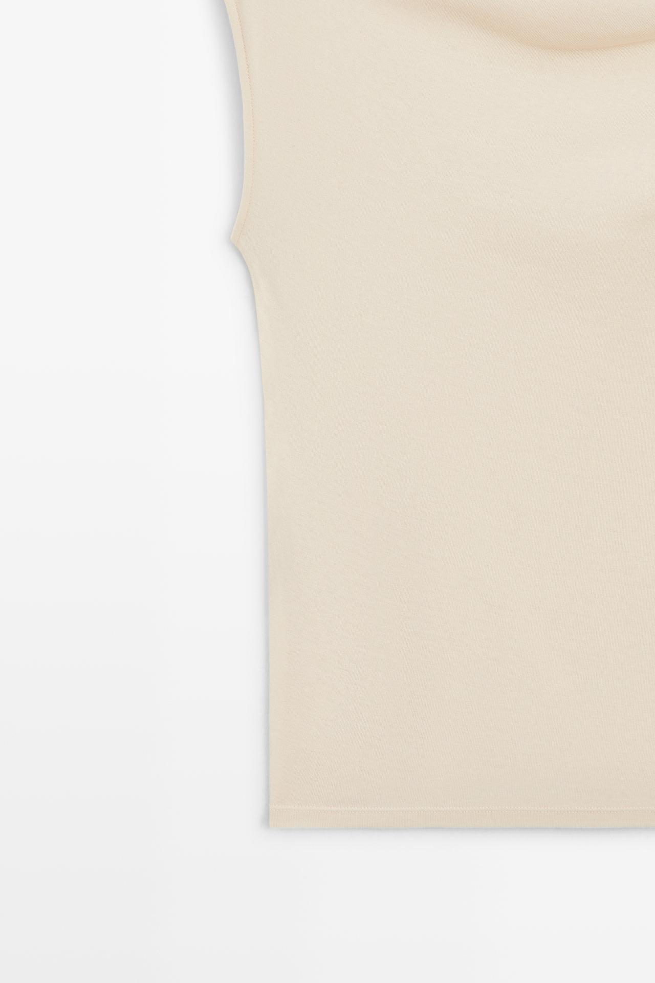 Asymmetric metal detail top — CREAM