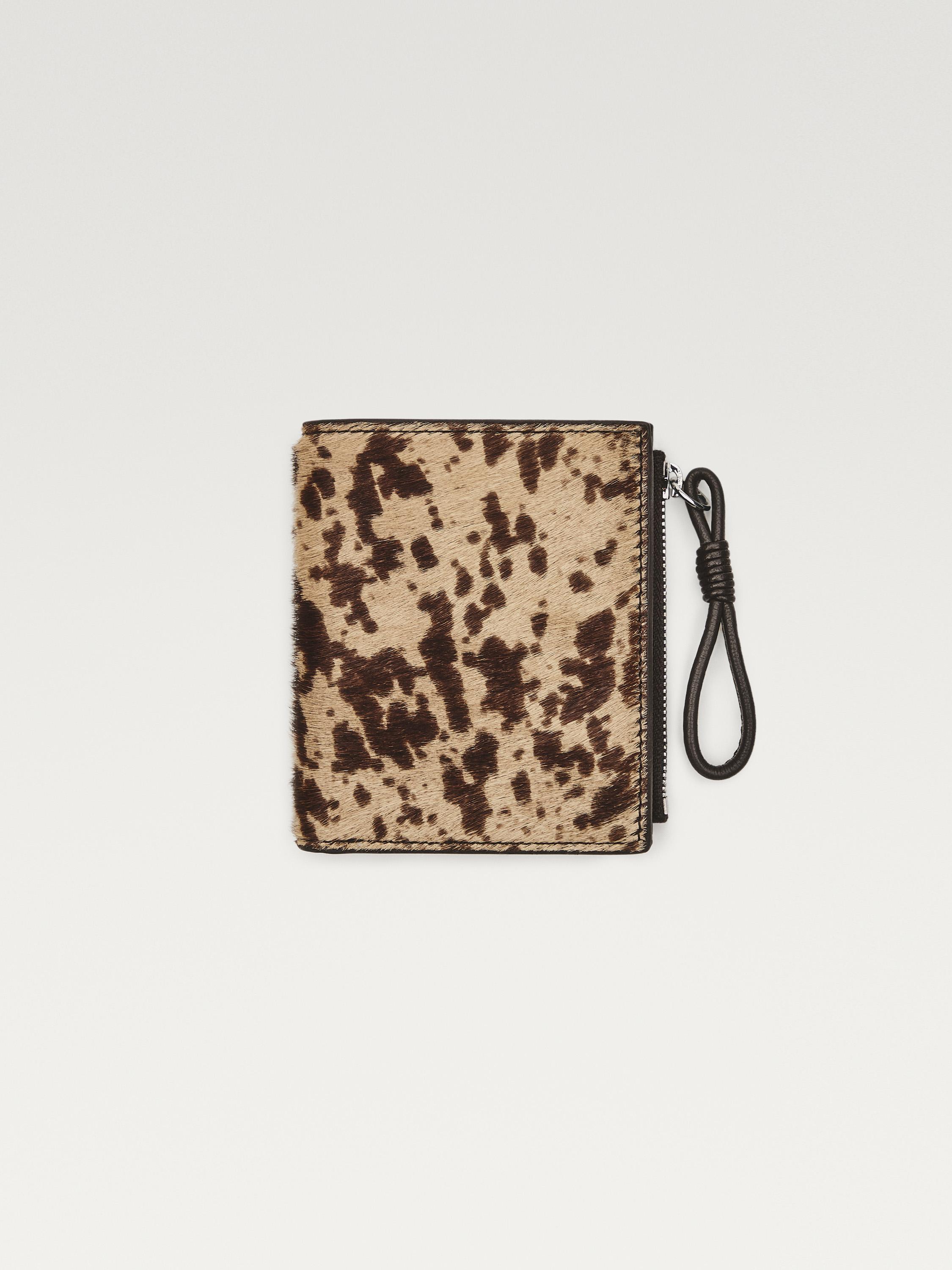 Cartera piel con pelo estampado animal