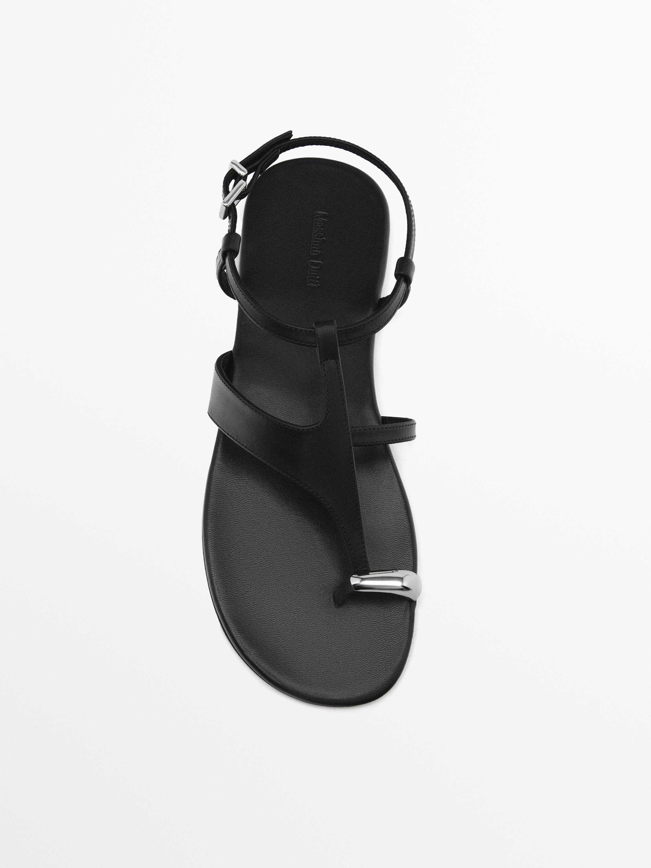Flat sandals with metallic embellishment