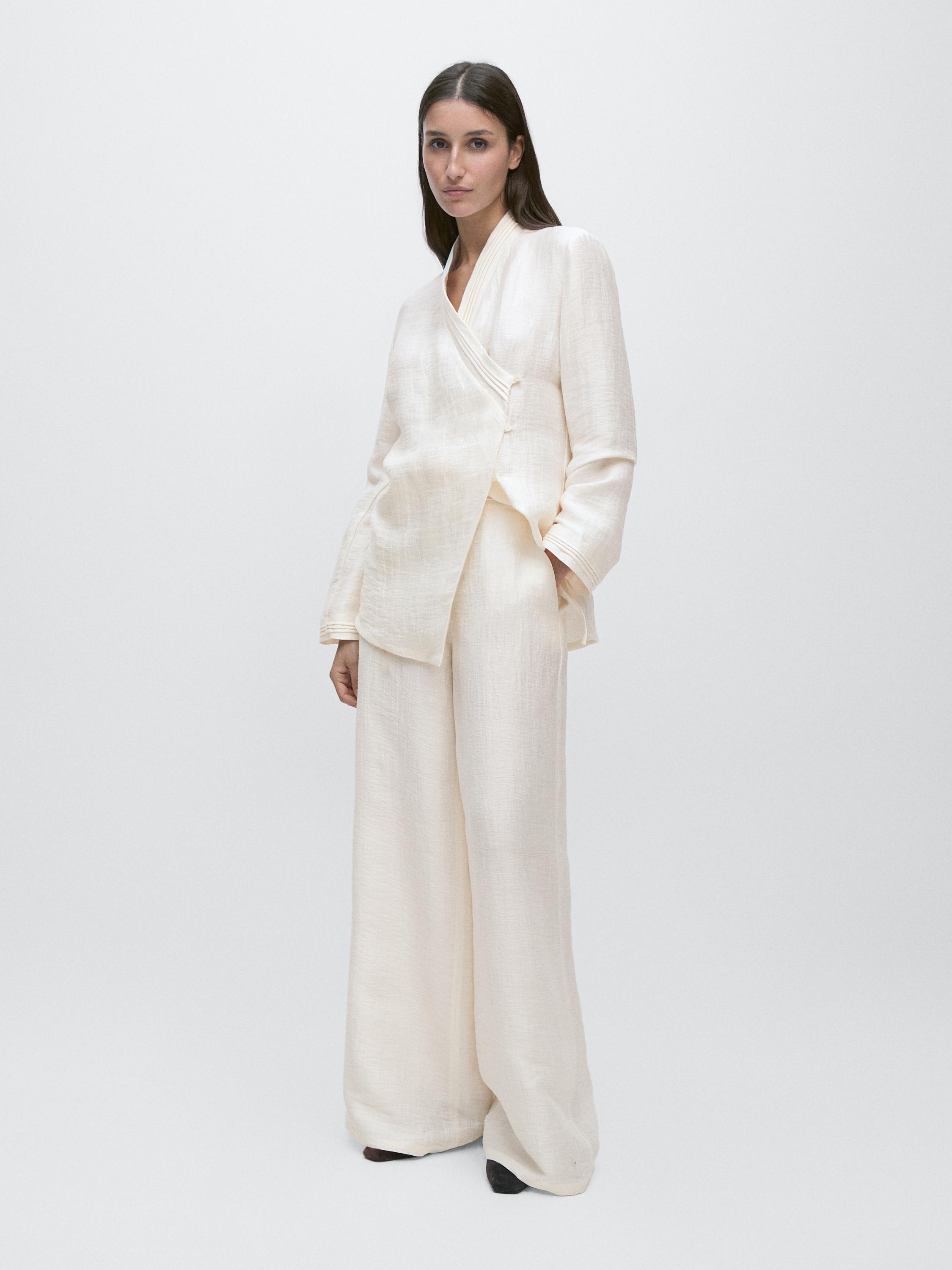 Flowing linen blend trousers with waistband detail