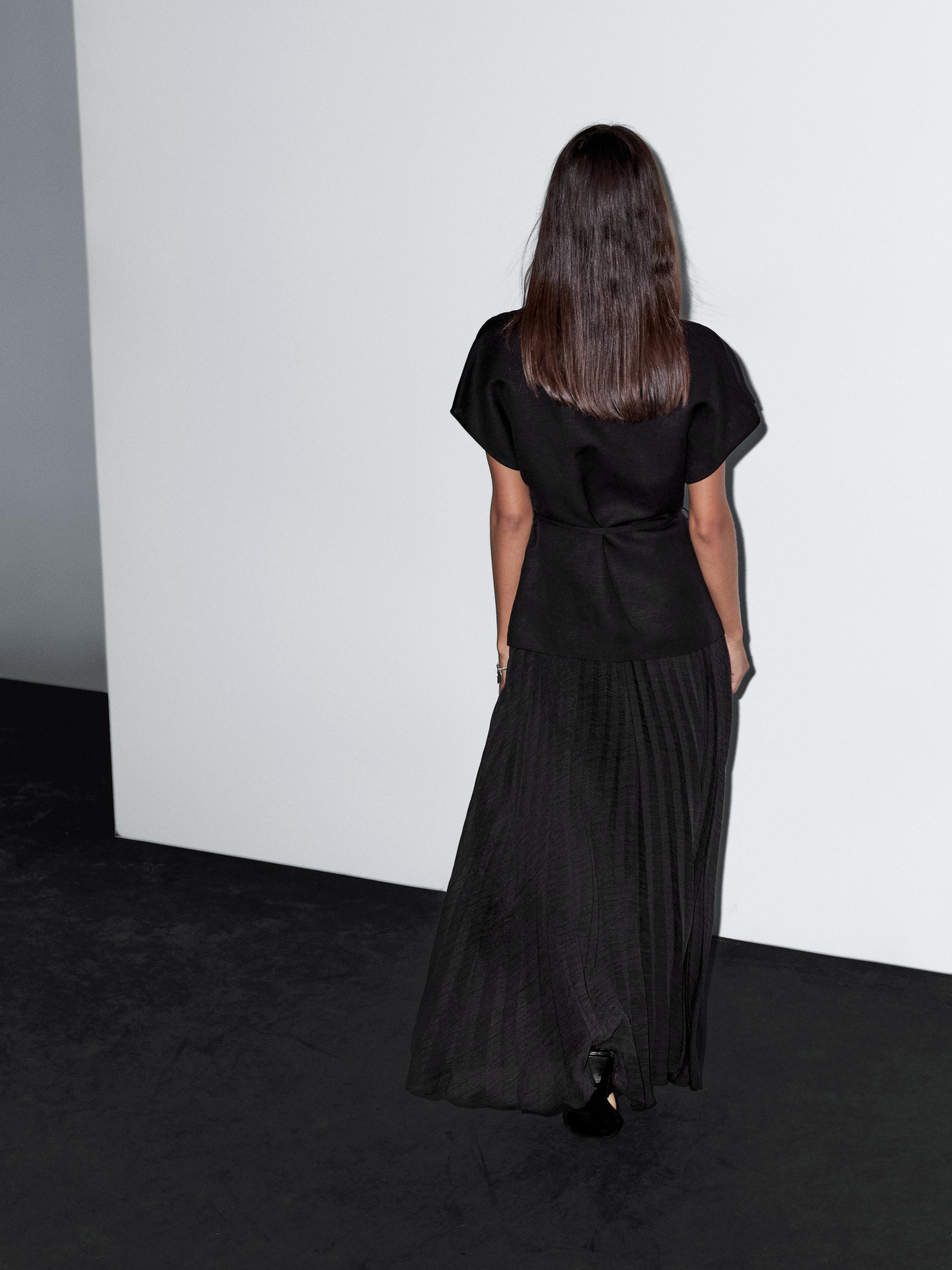 Long pleated dress with waistcoat detail