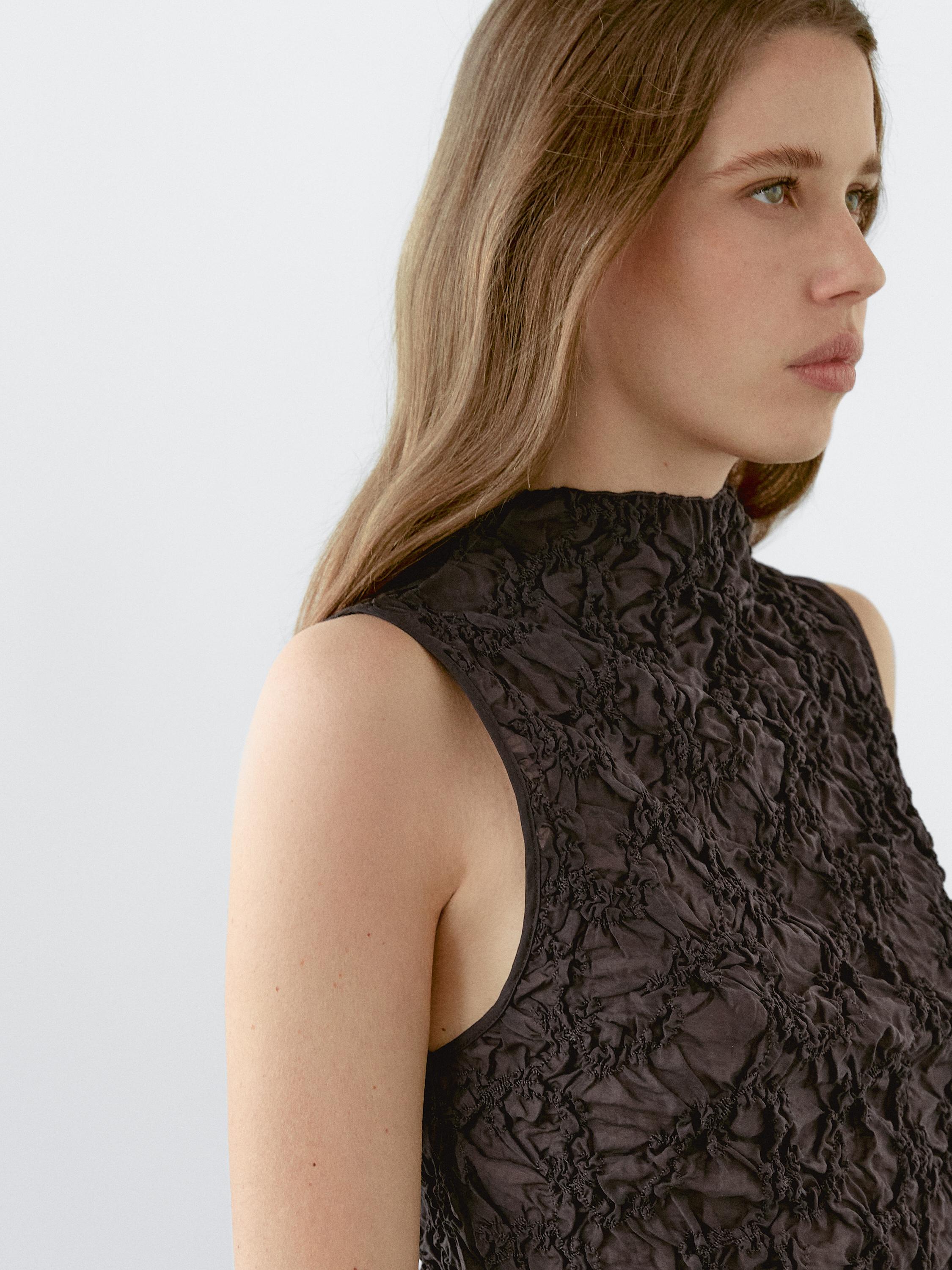 Creased-effect funnel neck top