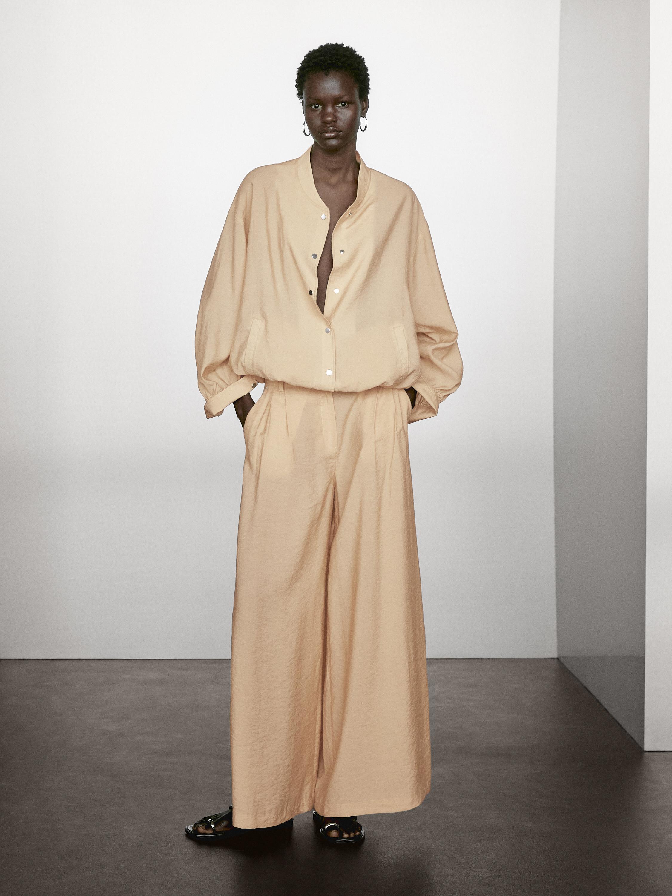 Loose-fitting bomber jacket with drawstring detail