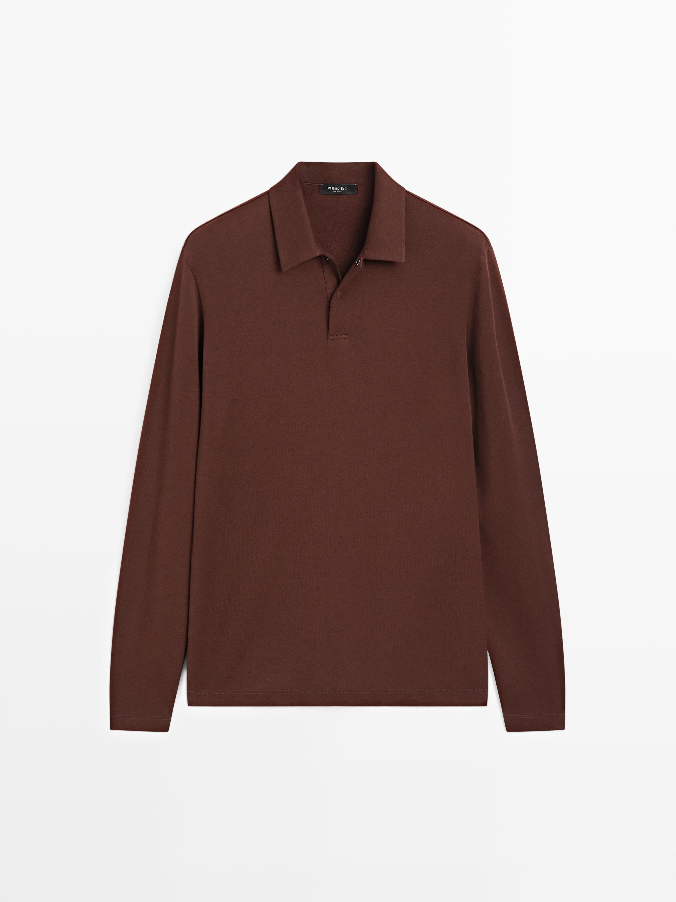 Front view of a burgundy long-sleeve polo shirt with a classic collar and snap button closure.