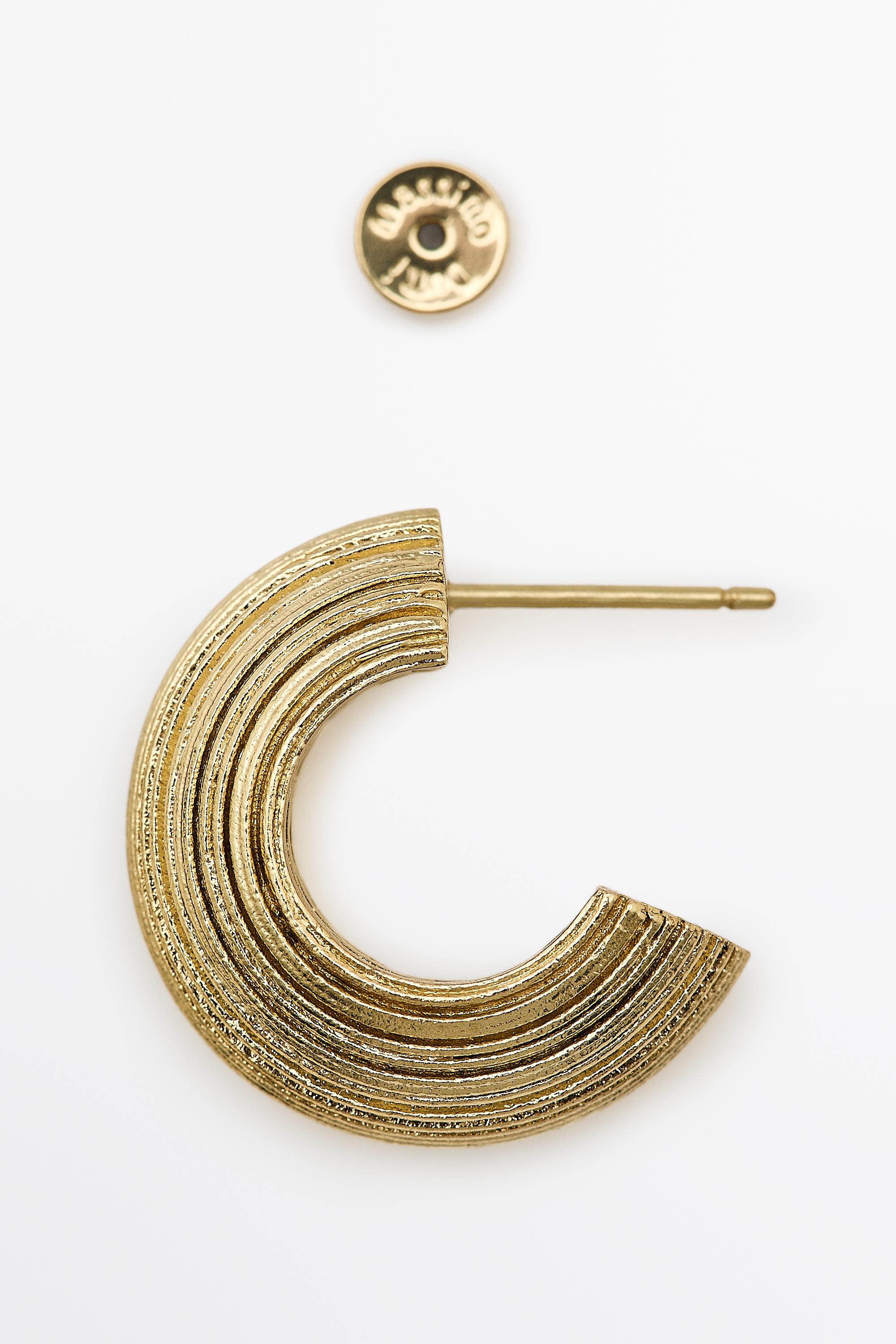 Raised design hoop earrings — GOLDEN
