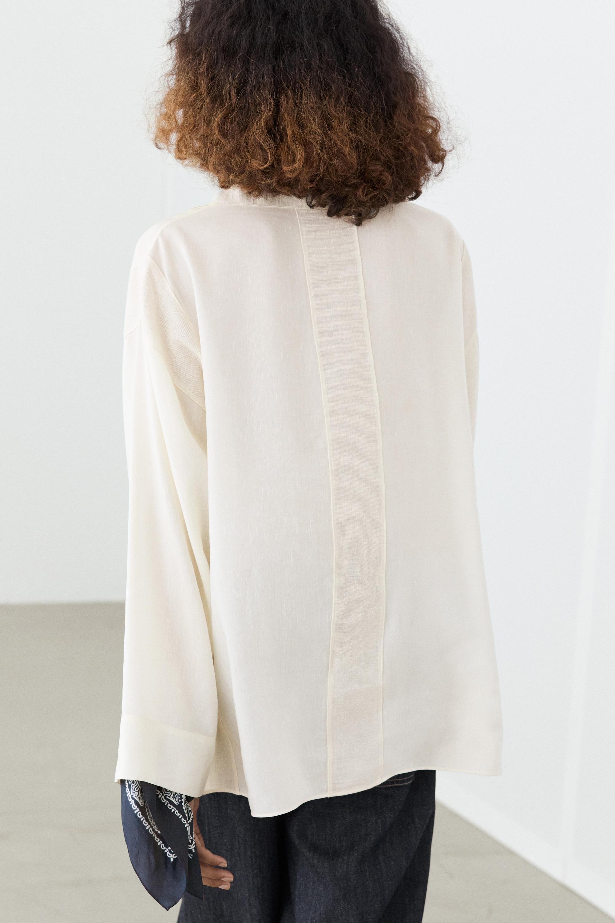 Flowing blouse with seam details — CREAM