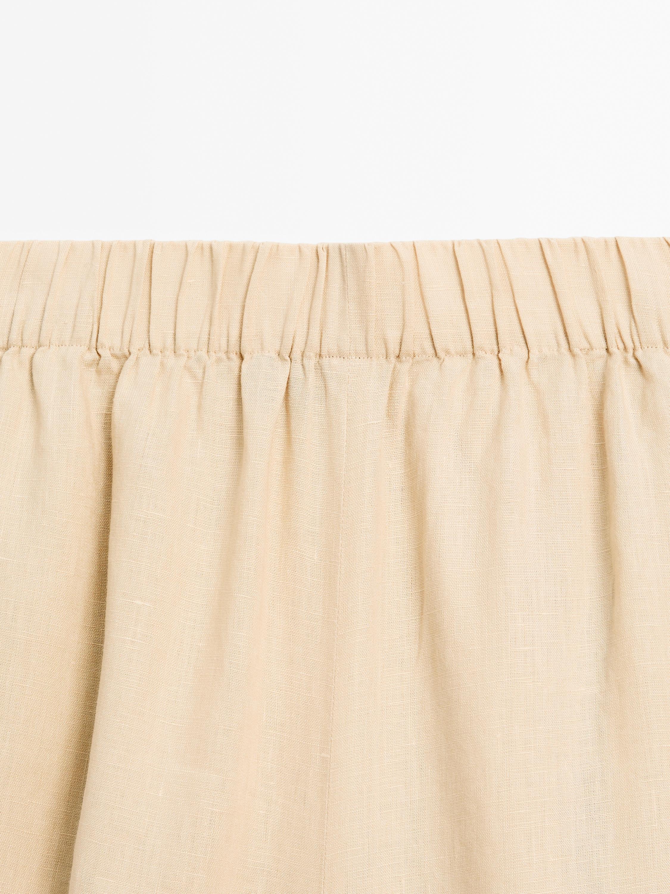Flowing 100% linen trousers with elastic detail