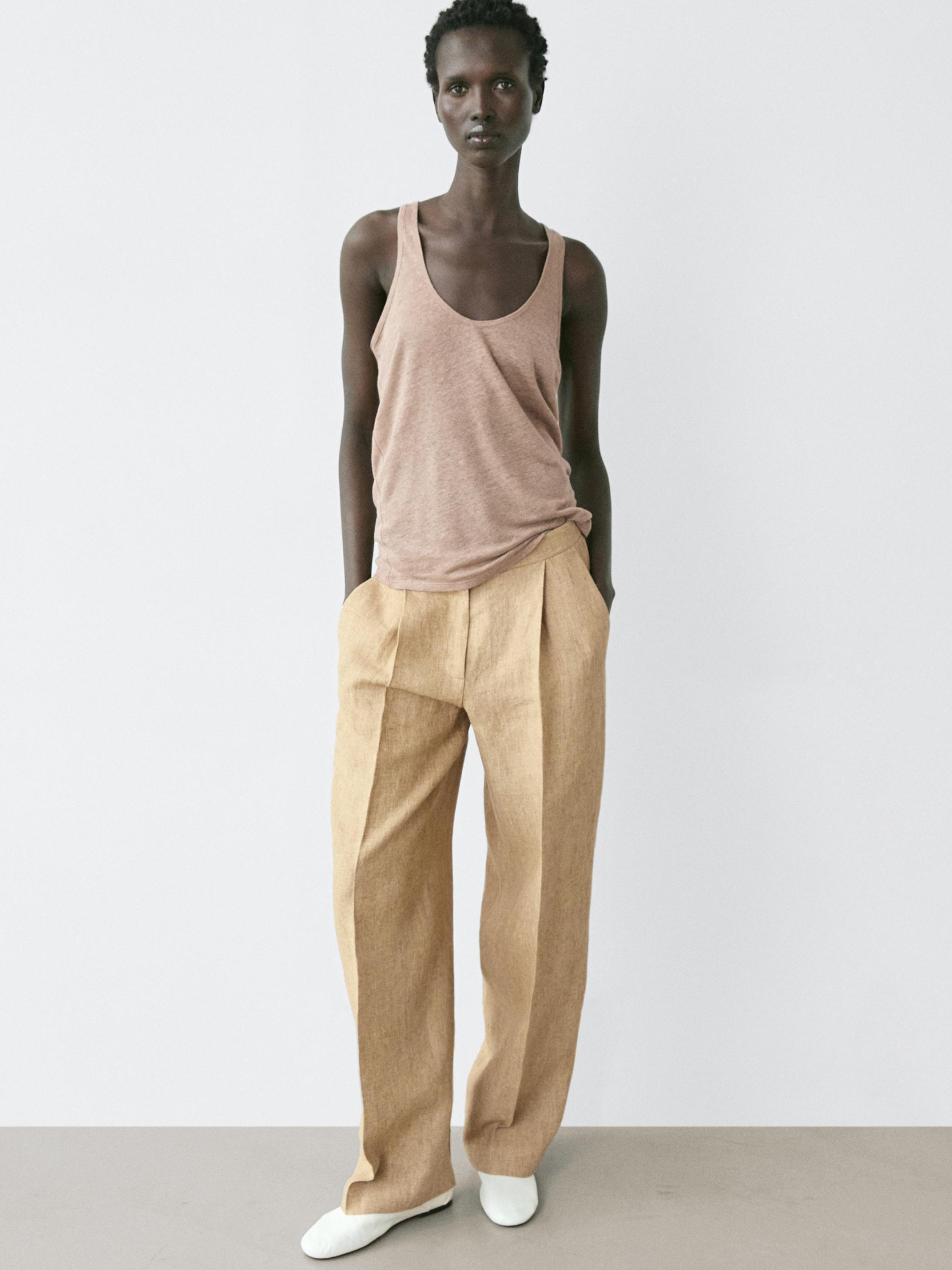 بنطلون واسع بتفاصيل بنسات كتان